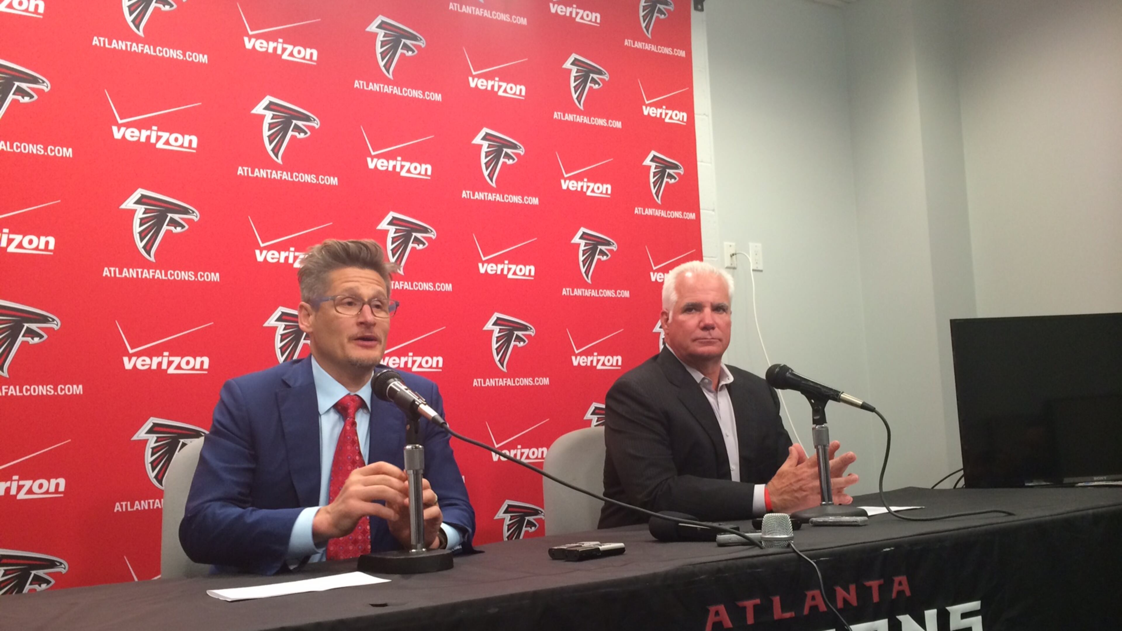 Falcons general manager Thomas Dimitroff and head coach Mike Smith discussing the second and third round picks in May during the draft. (D. Orlando Ledbetter/Dledbetter@ajc.com)