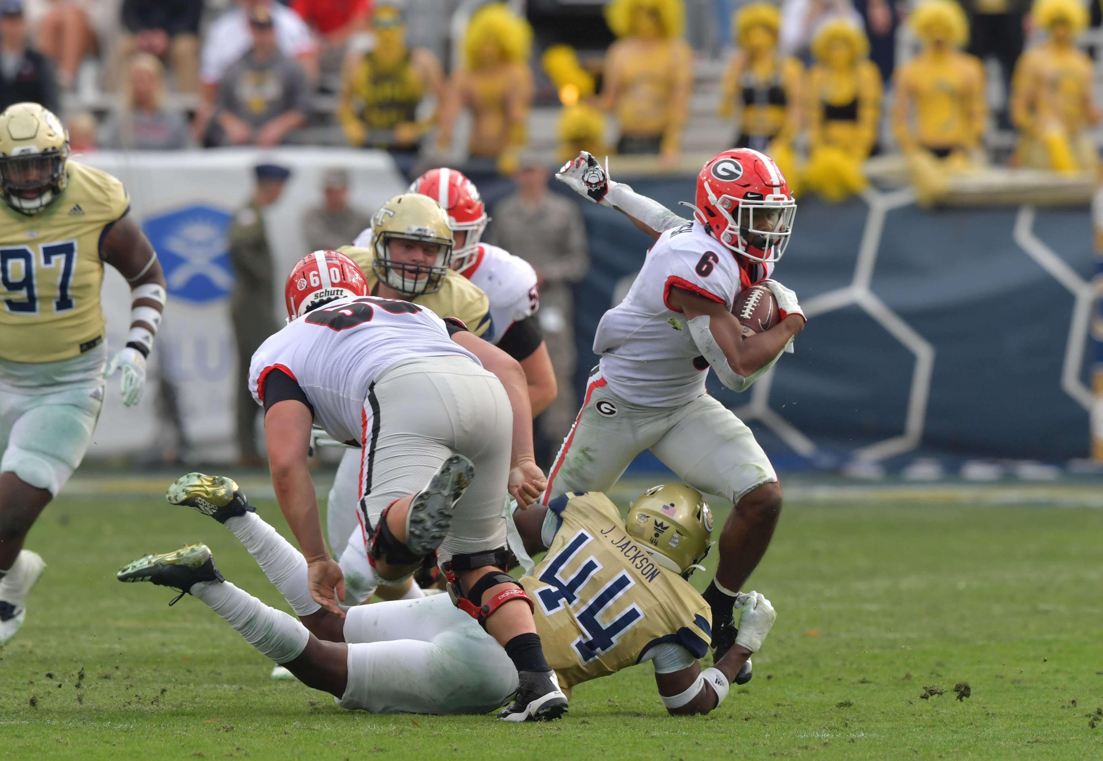 Georgia running back Kenny McIntosh (6) runs past Georgia Tech linebacker Quez Jackson (44) during the second half of an NCAA college football game at Bobby Dodd Stadium on Saturday, November 30, 2019. Georgia won 52-7 over the Georgia Tech. (Hyosub Shin / Hyosub.Shin@ajc.com)