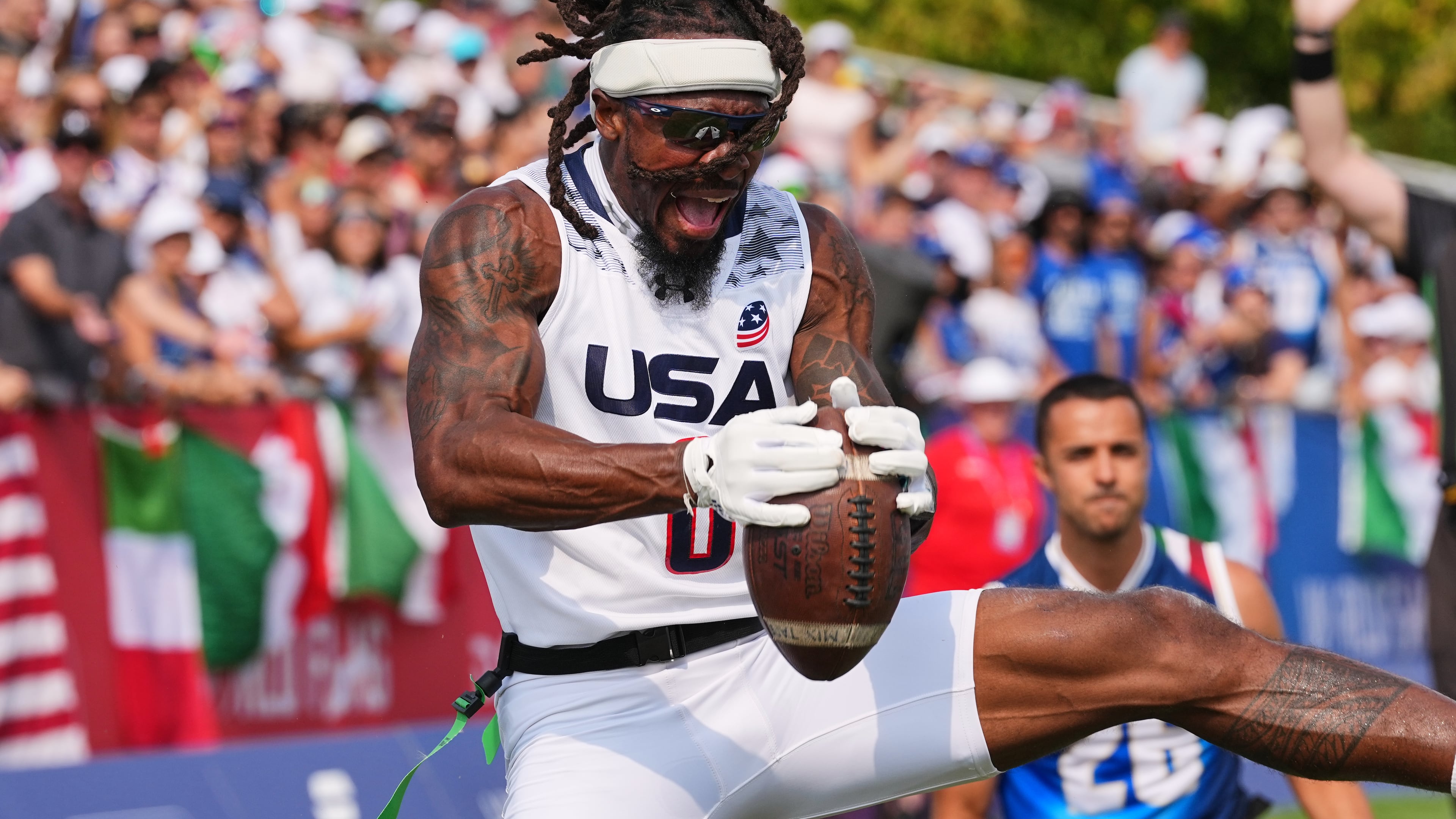 United States' Tyler "TD" Davis celebrates a touchdown during the Flag Football World Championship men's final game between Italy and USA in Duesseldorf, Germany, Sunday, Aug. 16, 2026. (AP Photo/Martin Meissner)