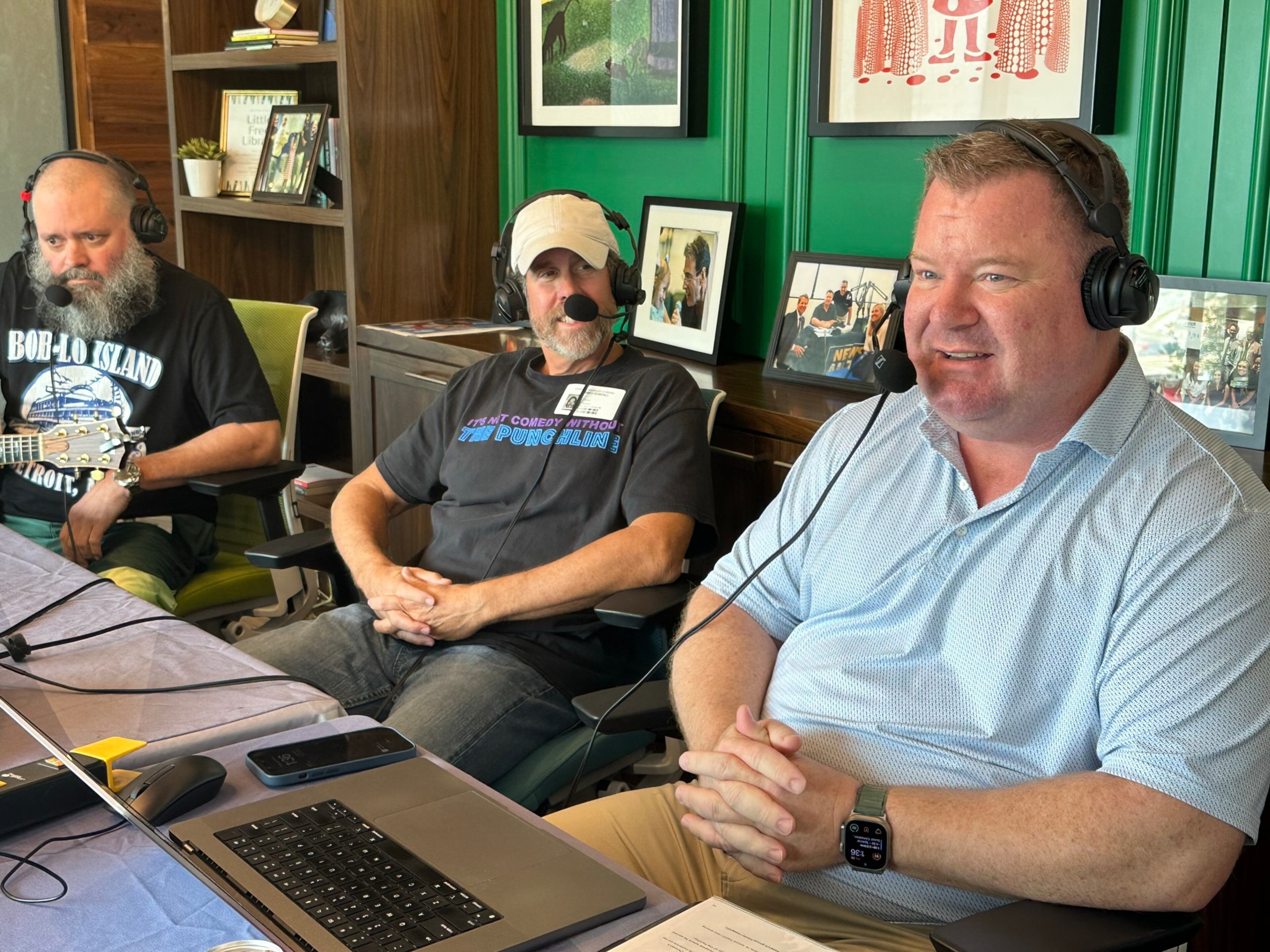 Erick Erickson of WSB (right) during the annual Care-a-thon for the Aflac Cancer and Blood Disorders Center on July 28, 2023. He is talking to comic J. Chris Newberg (left) and Punchline owner Jamie Bendall. RODNEY HO/rho@ajc.com