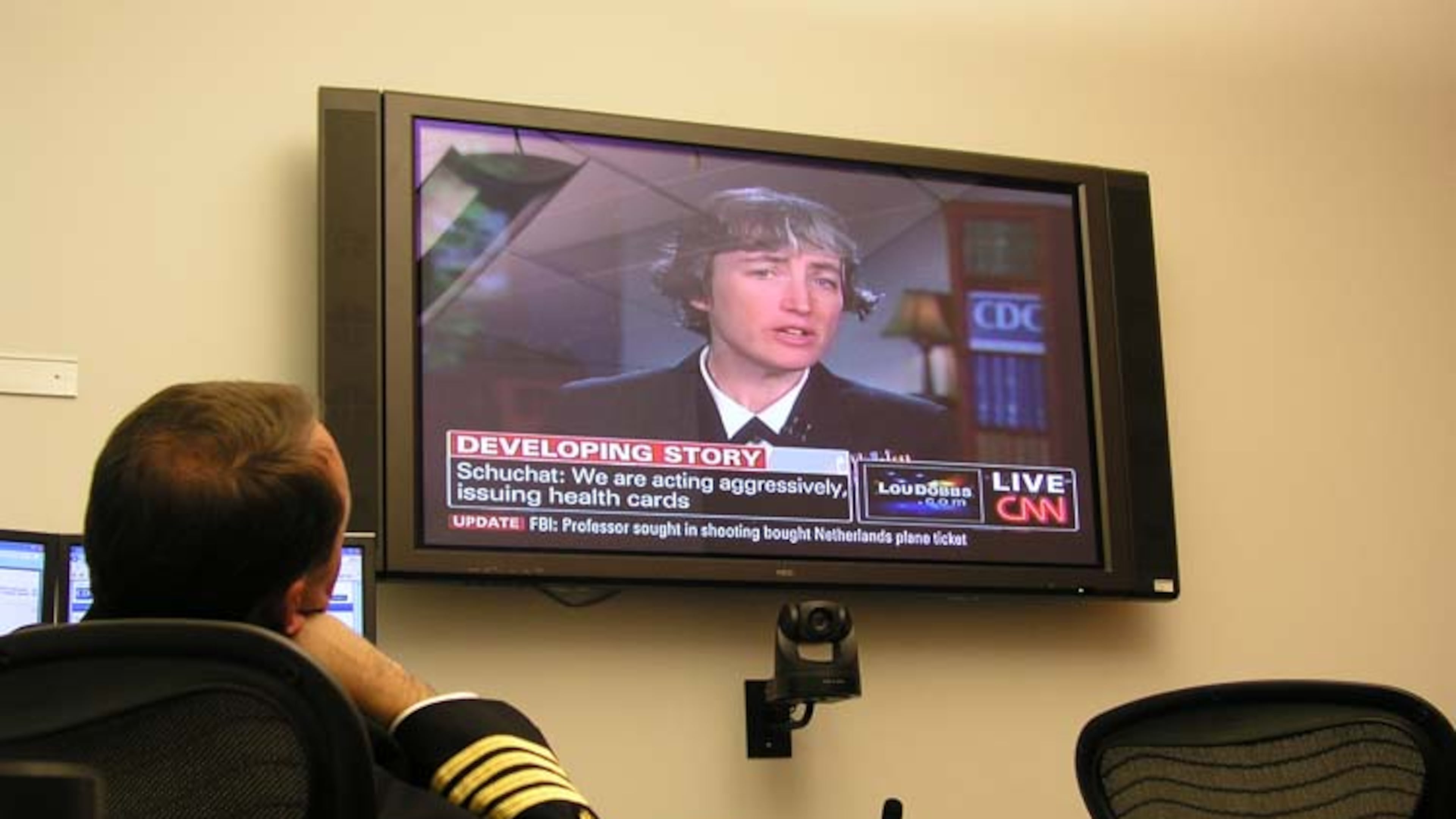 Dr. Anne Schuchat appears on CNN to give updates to the public during the 2009 H1N1 pandemic, while Daniel Jernigan, leader of the Epidemiology and Laboratory Task Force, watches. During the pandemic, Schuchat acted as the face of the CDC, keeping the public up to date on the evolving situation. CENTERS FOR DISEASE CONTROL AND PREVENTION