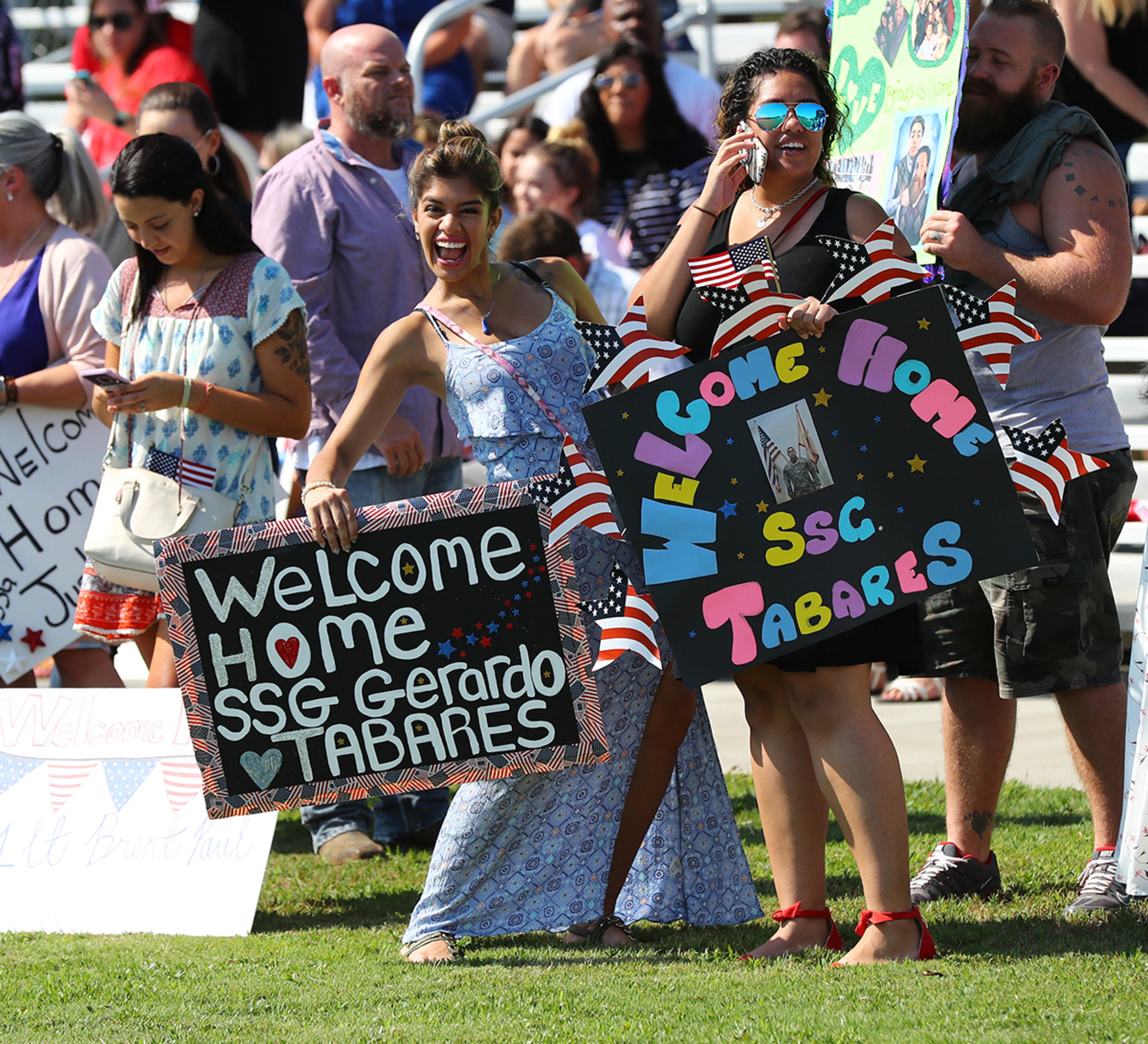 July 30, 2019 Fort Stewart: The family of staff sergeant Gerardo Tabares awaits his arrival as soldiers of the 48th Infantry Brigade Combat Team representing units from across the state return home from deployment to Afghanistan in support of Operation Resolute Support at Cottrell Field on Tuesday, July 30, 2019, in Fort Stewart. Curtis Compton/ccompton@ajc.com