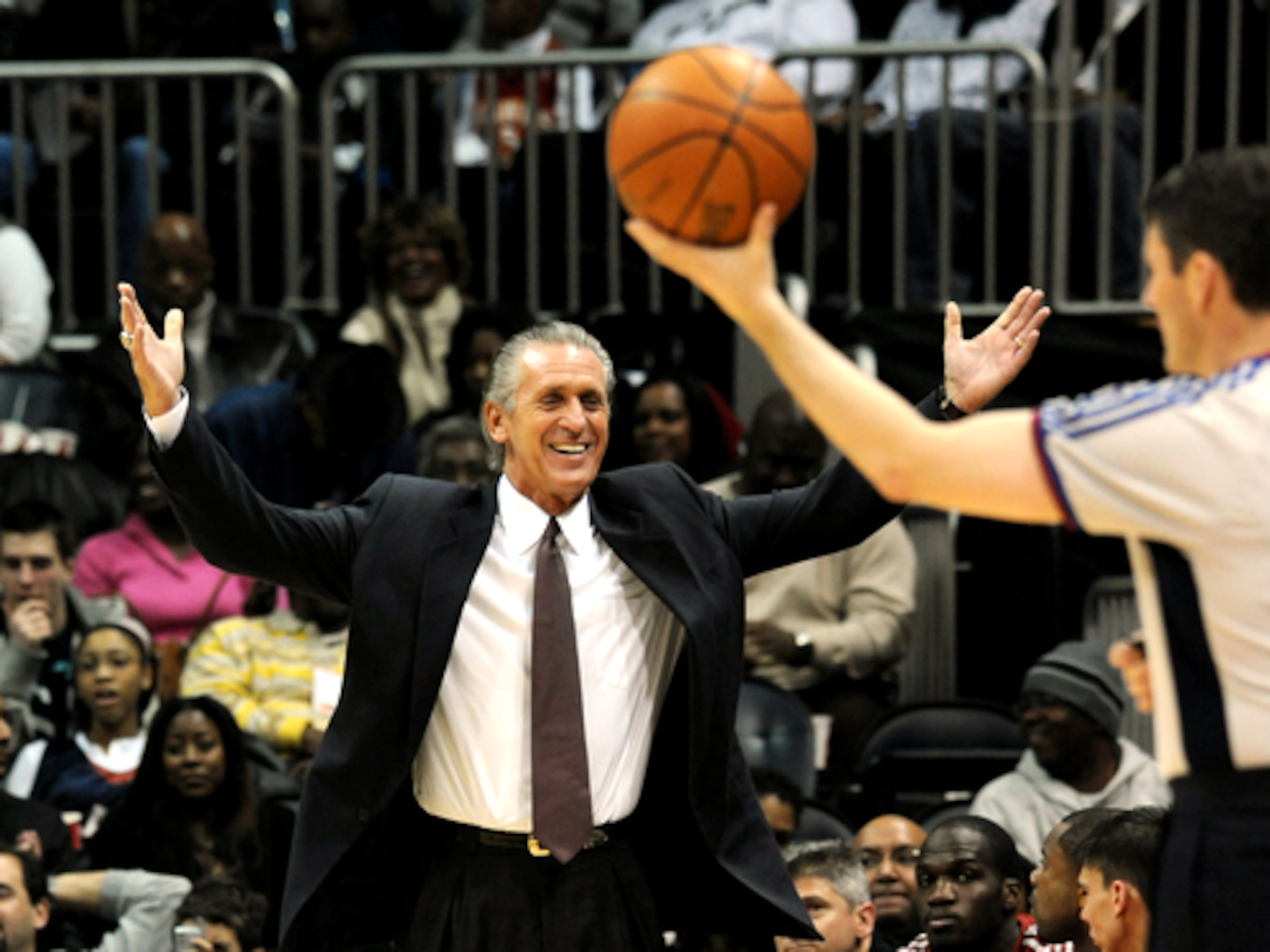Heat coach Pat Riley reacts with a smile as a video is played on the main scoreboard naming his team as the biggest criers in sports history for protesting the Dec. 19 game.