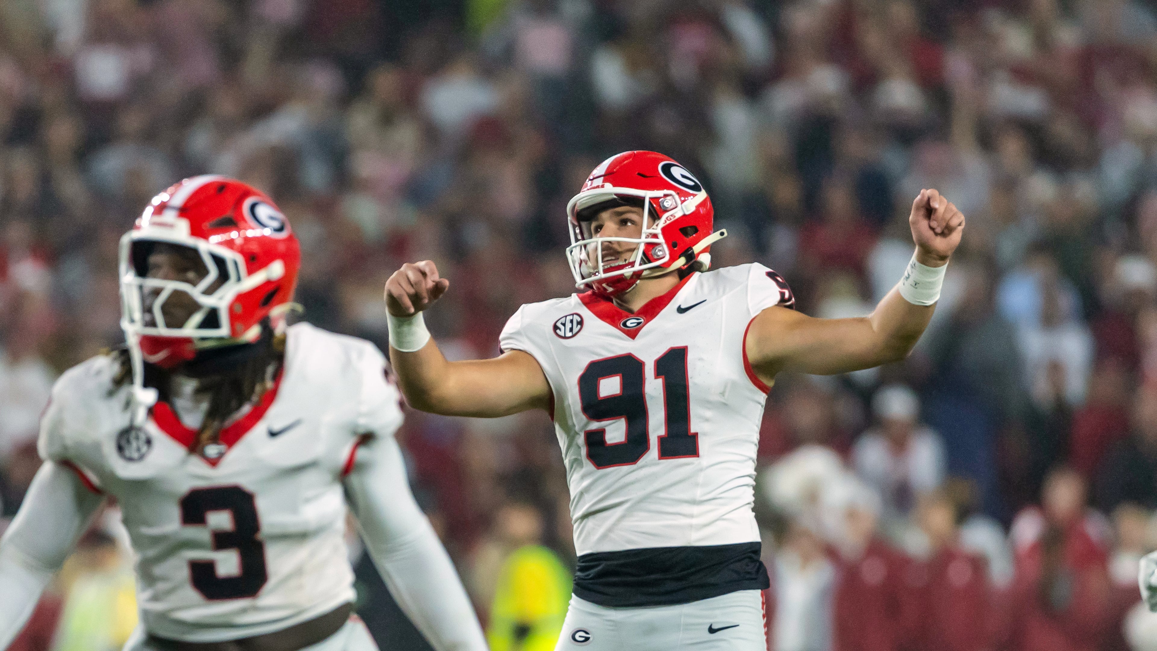 Georgia kicker Peyton Woodring (91) watches his field goal against Alabama during the first half of an NCAA college football game Saturday, Oct. 10, 2026, in Tuscaloosa, Ala. (AP Photo/Vasha Hunt)
