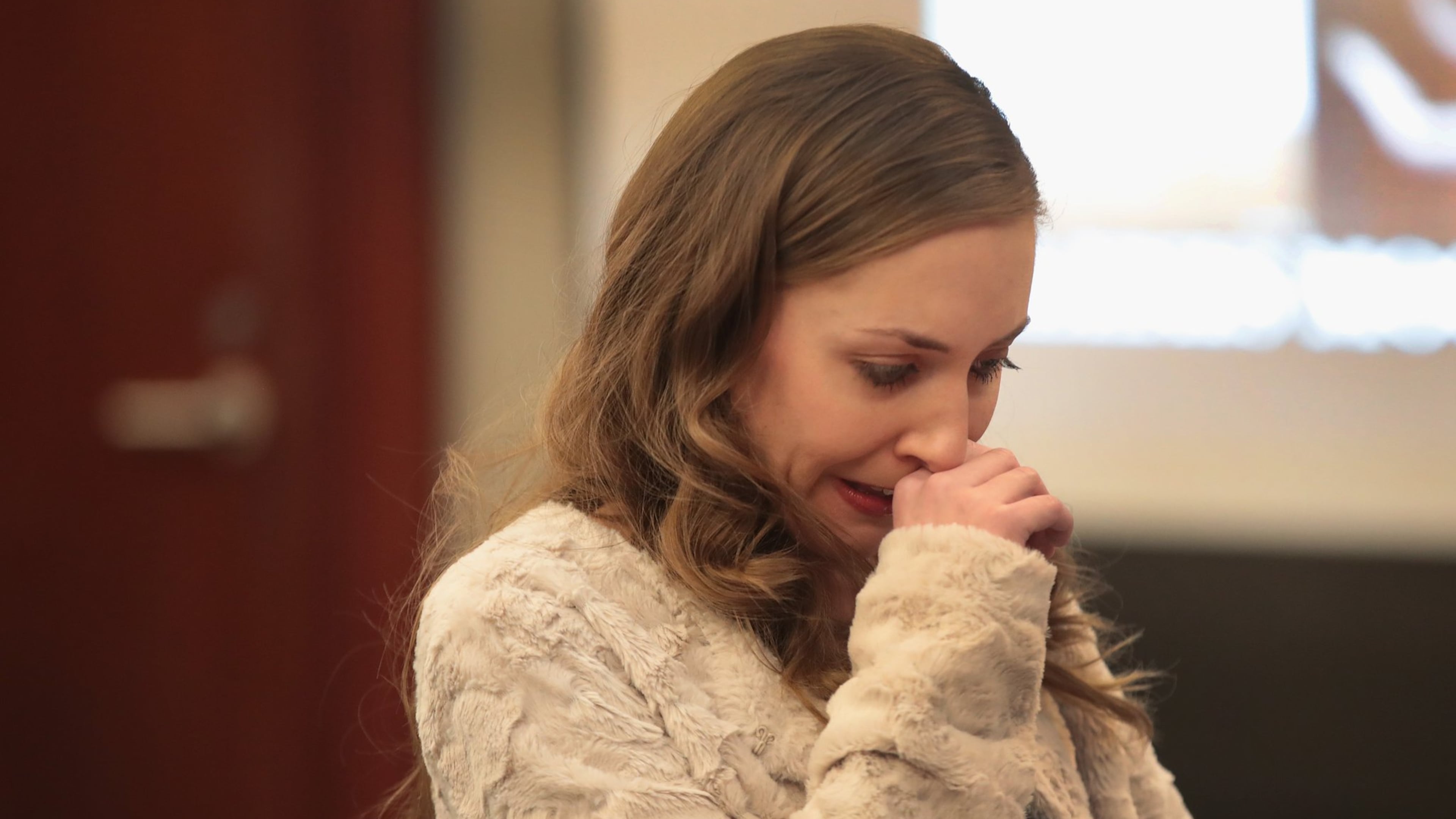 Alexis Moore gives a victim impact statement Tuesday at the sentencing of Dr. Larry Nassar, who has been accused of molesting about 100 girls while he was a physician for USA Gymnastics and Michigan State University, where he had his sports-medicine practice. Nassar has pleaded guilty in Ingham County, Michigan, to sexually assaulting seven girls, but the judge is allowing all his accusers to speak. Nassar is currently serving a 60-year sentence in federal prison for possession of child pornography. Scott Olson/Getty Images