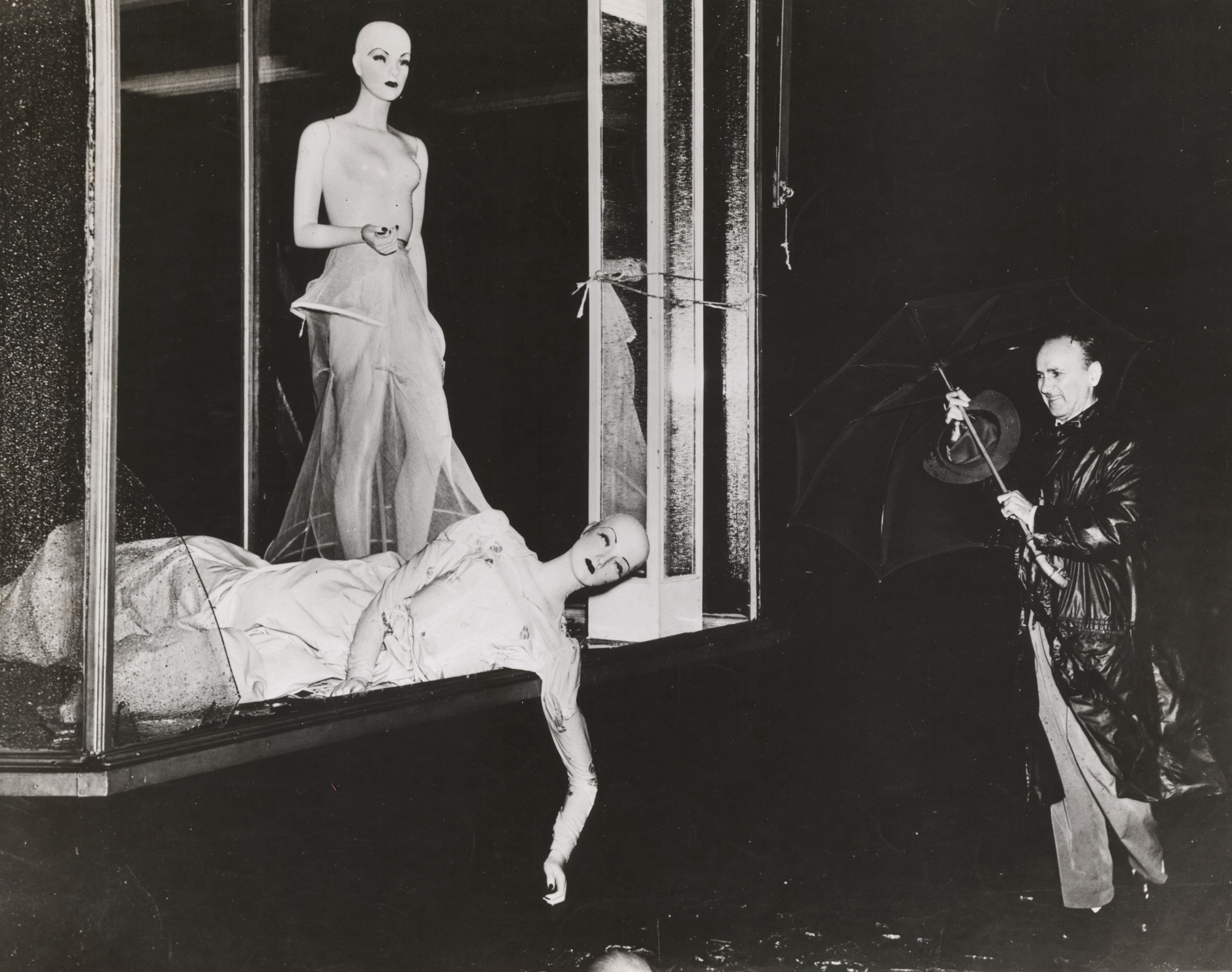 GREAT ATLANTIC HURRICANE, 1944: This powerful hurricane churned up the East Coast, from North Carolina to Maine, claiming almost 400 lives and costing over $100 million in damages. Seen here, a man struggles with his umbrella past damaged mannequins on the window of the Edith and Billie Bridal Salon at 271 Grand Street in New York city. (Photo by Weegee(Arthur Fellig)/International Center of Photography/Getty Images)