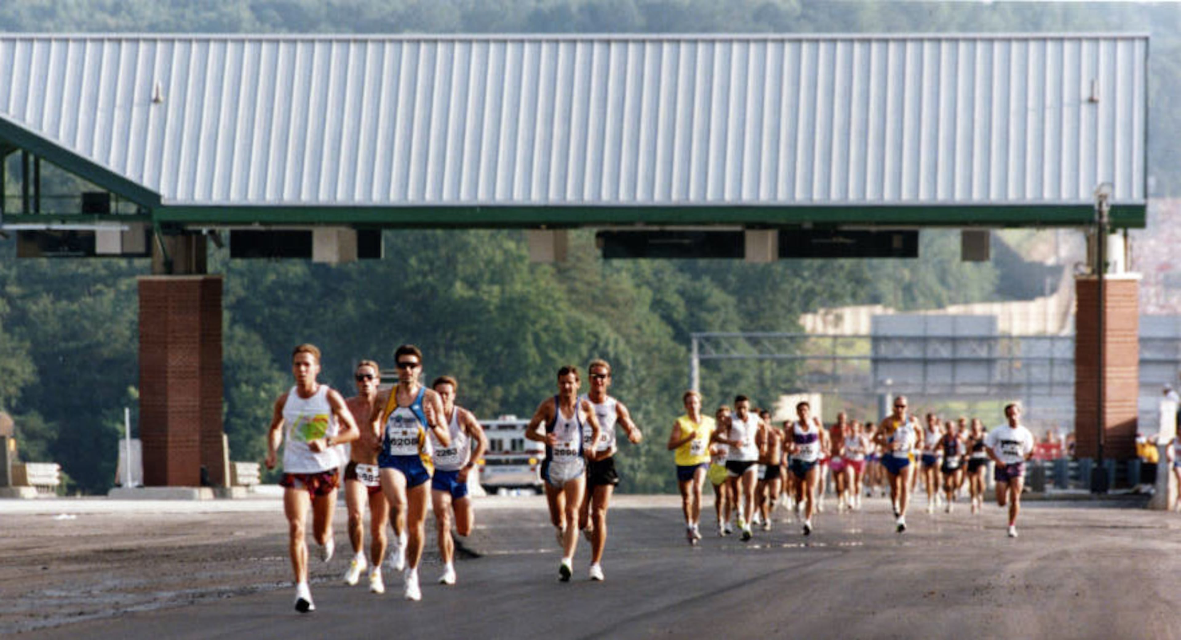 Road race on Georgia 400, before it opens to auto traffic, Atlanta, Georgia, June 19, 1993. This is about the half way point, just past the toll plaza during the one-time four-mile run.