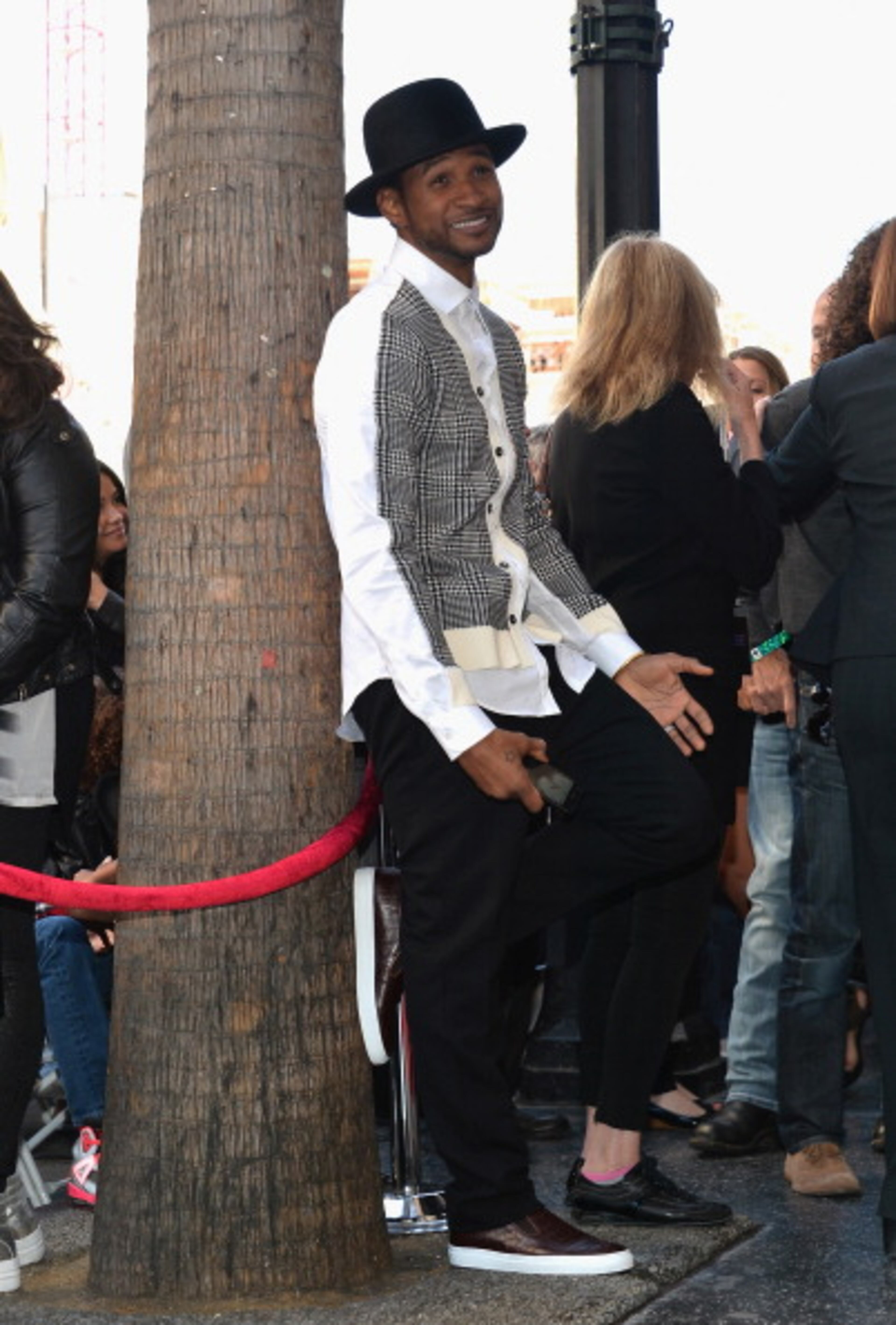 HOLLYWOOD, CA - OCTOBER 10: Singer Usher Raymond attends a ceremony honoring Kenny "Babyface" Edmonds with the 2508th Star on the Hollywood Walk of Fame on October 10, 2013 in Hollywood, California. (Photo by Alberto E. Rodriguez/Getty Images)