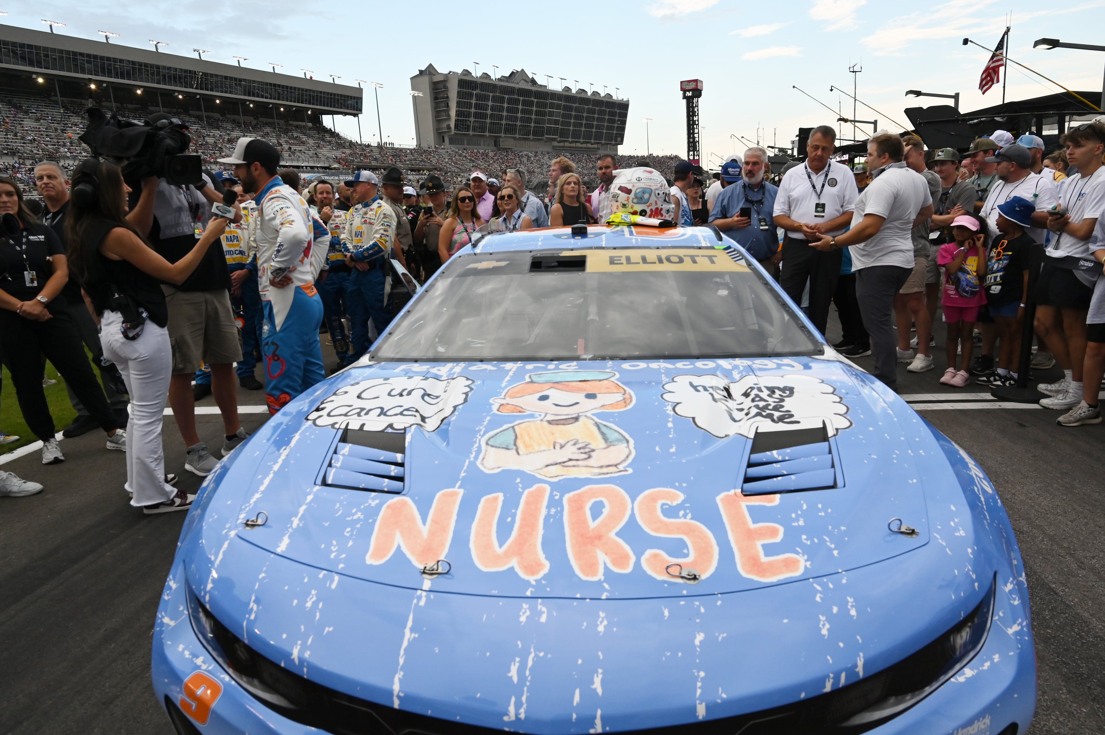 NASCAR Cup Series driver Chase Elliott is interviewed before Quaker State 400 NASCAR Cup Series race at EchoPark Speedway, Saturday, June 28, 2025, in Hampton. 11-year-old Rhealynn Mills recently won a contest for her artwork to appear on NASCAR driver Chase Elliott's car. (Hyosub Shin / AJC)