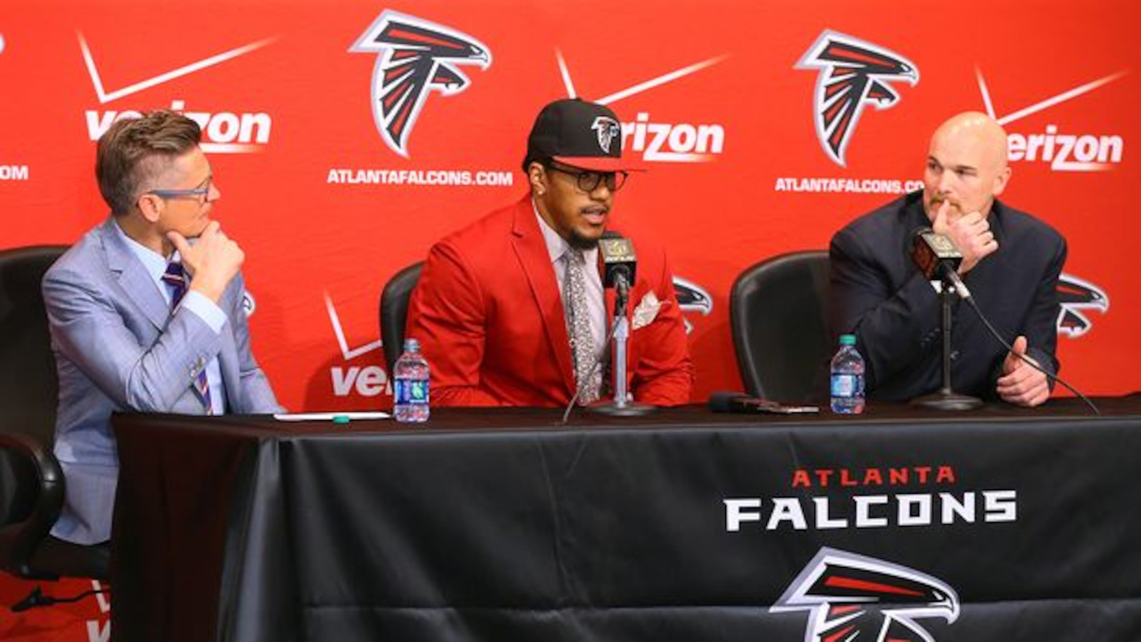 Falcons General Manager Thomas Dimitroff (left) and head coach Dan Quinn look on as first-round draft pick Vic Beasley takes questions from the media during his press conference at the Falcons training facility on Friday, May 1, 2015, in Flowery Branch. Beasley, who was the 8th overall pick in the NFL draft, is Clemson's sack leader. Curtis Compton / ccompton@ajc.com
