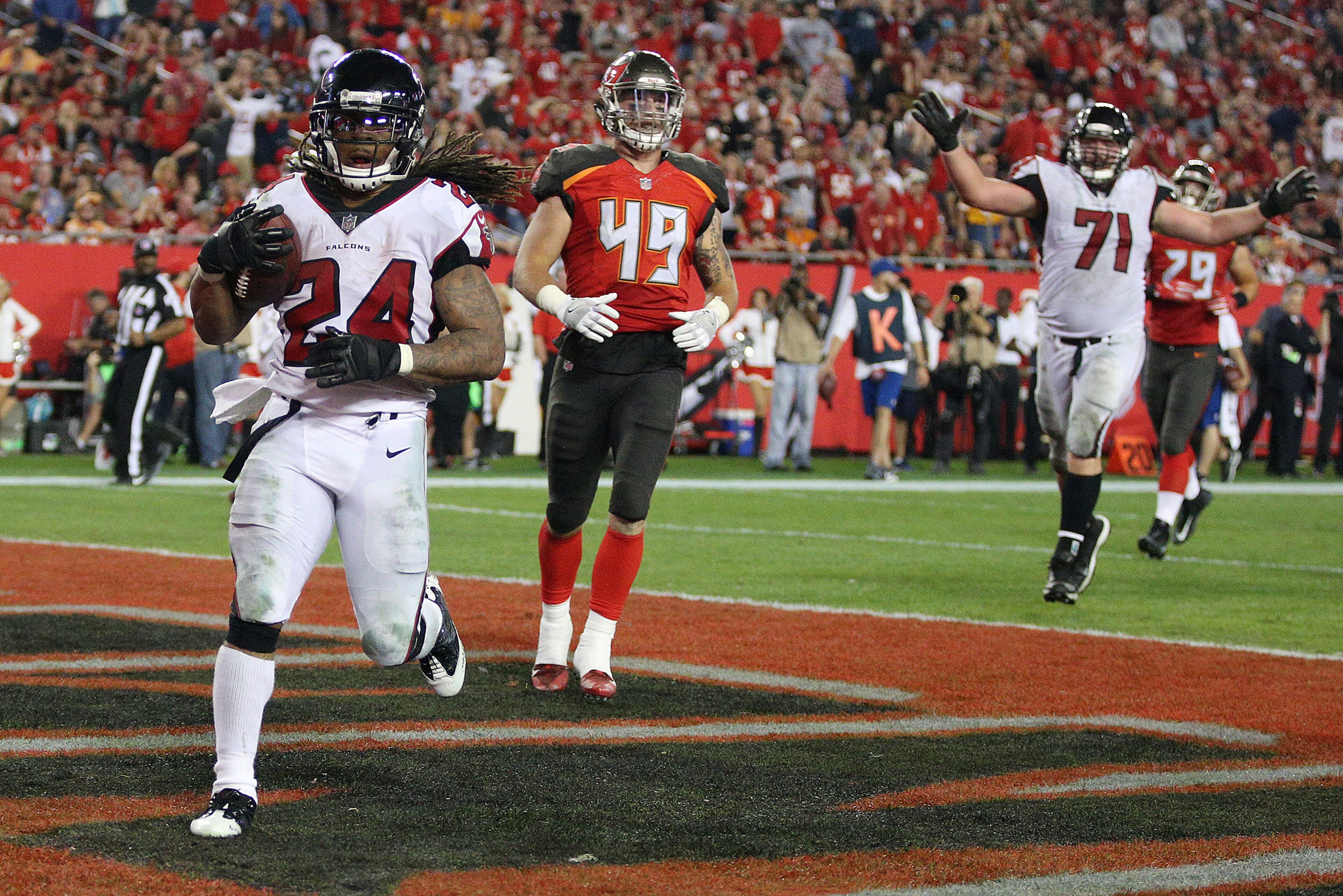 December 18, 2017 Tampa: Falcons running back Devonta Freeman hits the endzone for a 24-14 lead over the Buccaneers during the fourth quarter in a NFL football game on Monday, December 18, 2017, in Tampa. The Falcons held on to beat the Bucs 24-21. Curtis Compton/ccompton@ajc.com
