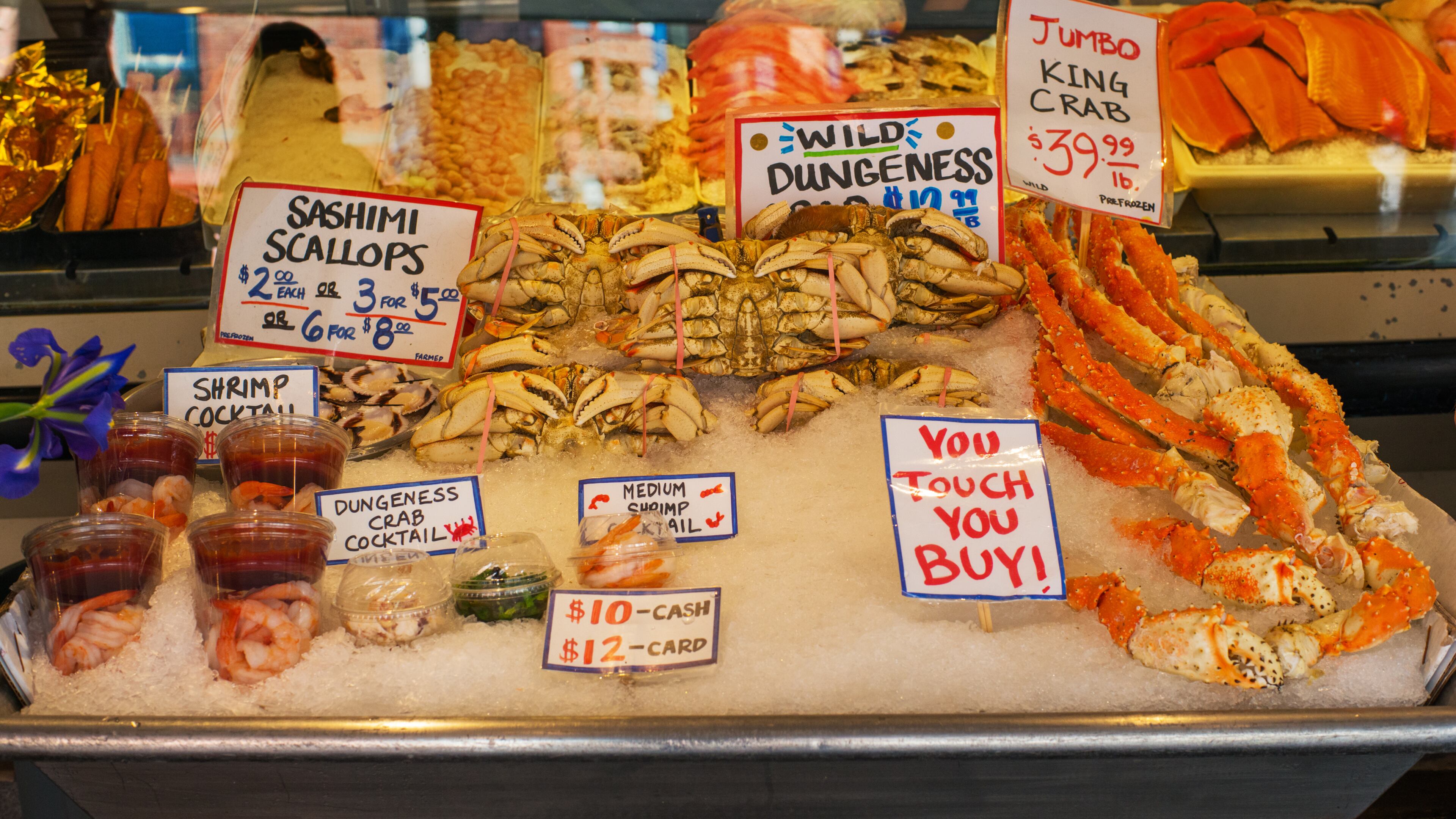 A display case of seafood at the Pike Place Market in Seattle. You touch, you buy! (Alan Behr/TNS)