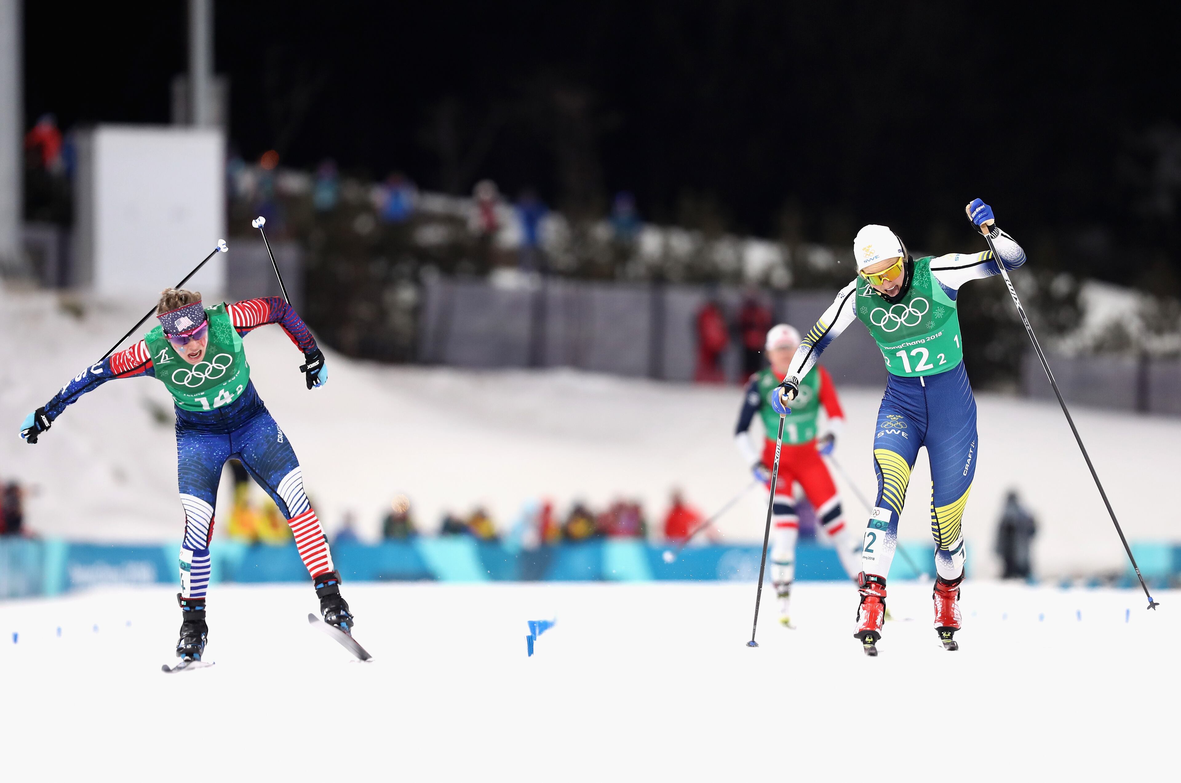 PYEONGCHANG-GUN, SOUTH KOREA - FEBRUARY 21: Jessica Diggins of the United States (14-2) stretches across the finish line to win gold ahead of Stina Nilsson of Sweden (12-2) during the Cross Country Ladies' Team Sprint Free Final on day 12 of the PyeongChang 2018 Winter Olympic Games at Alpensia Cross-Country Centre on February 21, 2018 in Pyeongchang-gun, South Korea. (Photo by Lars Baron/Getty Images)