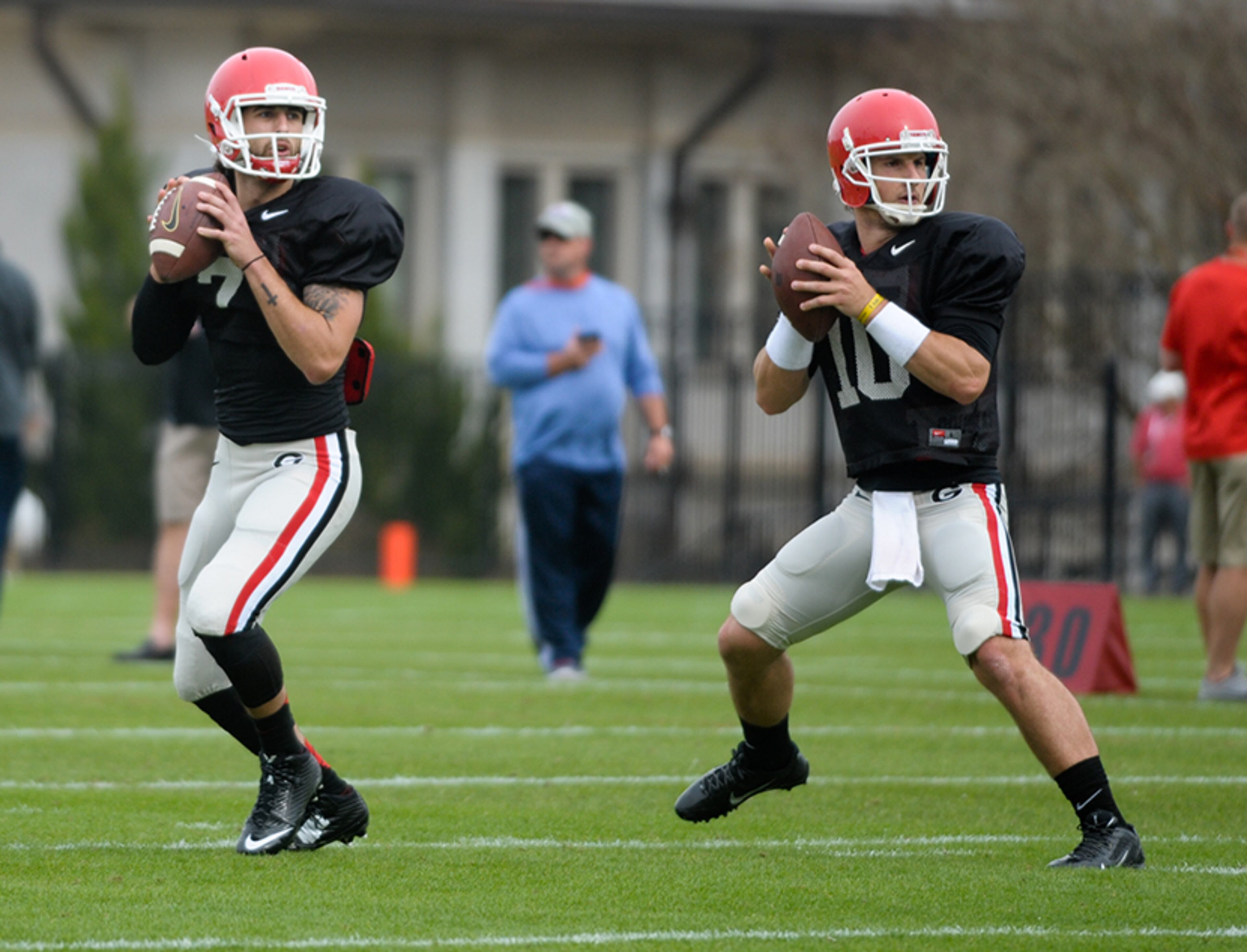 Jacob Park and Faton Bauta take part in quarterback drills during a Georgia spring football practice on Thursday, March 26, 2015, in Athens.