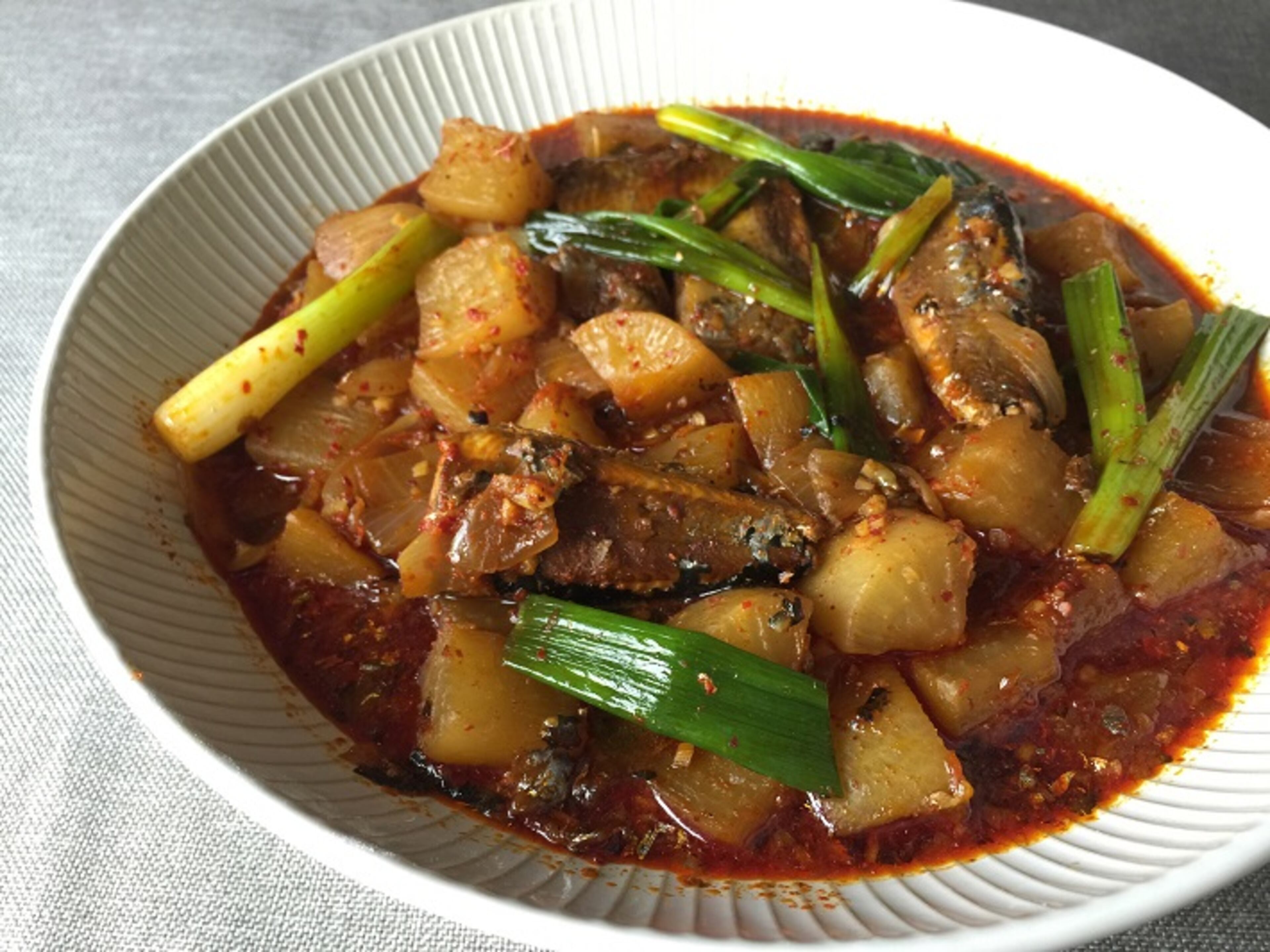 Braised daikon with saury (mackerel pike). (Leslie Brenner/Dallas Morning News/TNS) NO MAGAZINE SALES WEB USE BY TNS CONTRIBUTORS ONLY MANDATORY CREDIT