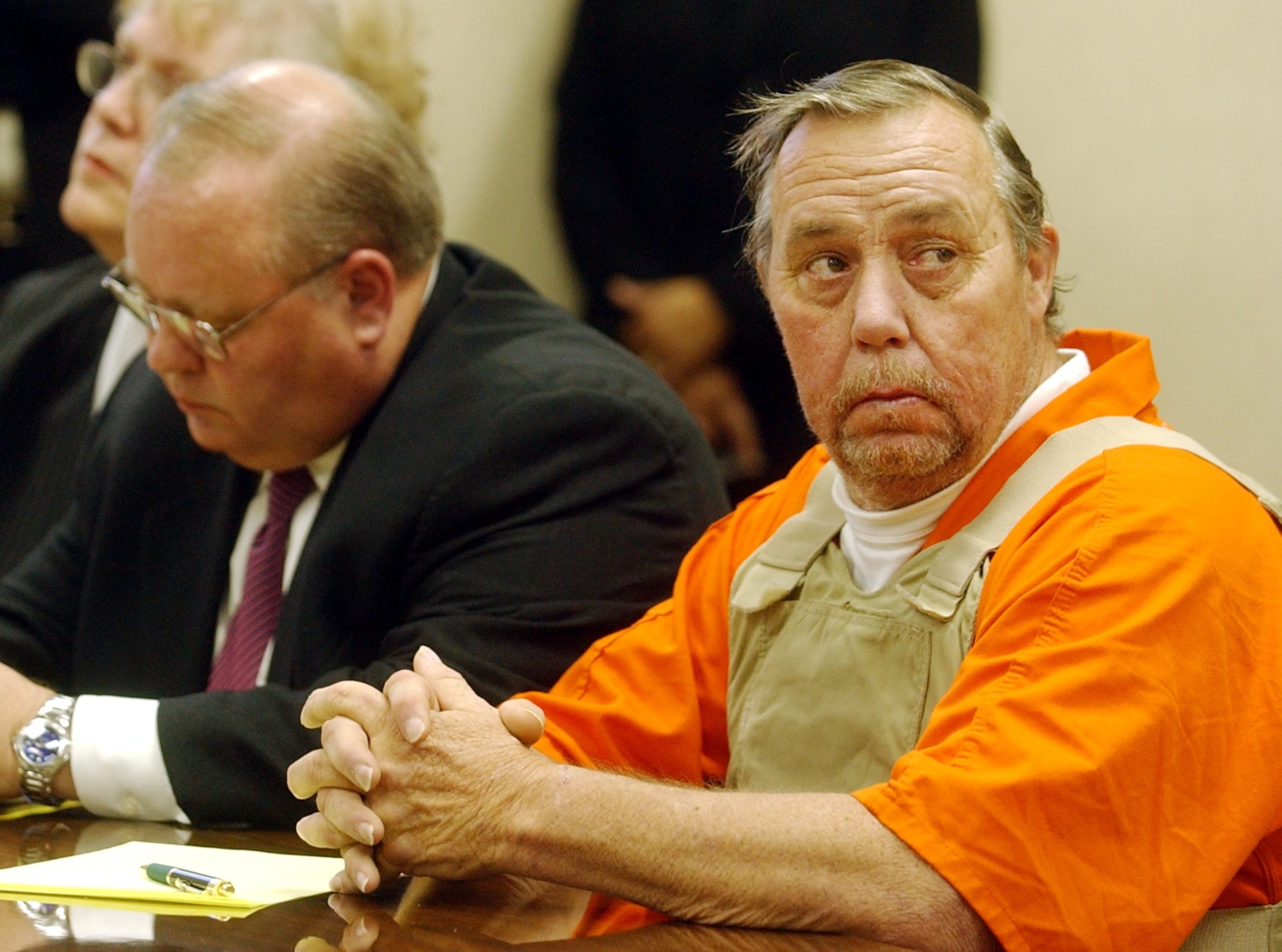 2003 -- Carl M. Patton, right, with his attorneys at a preliminary hearing in Fayette County for four murders that took place in 1977. (MARLENE KARAS/AJC file)