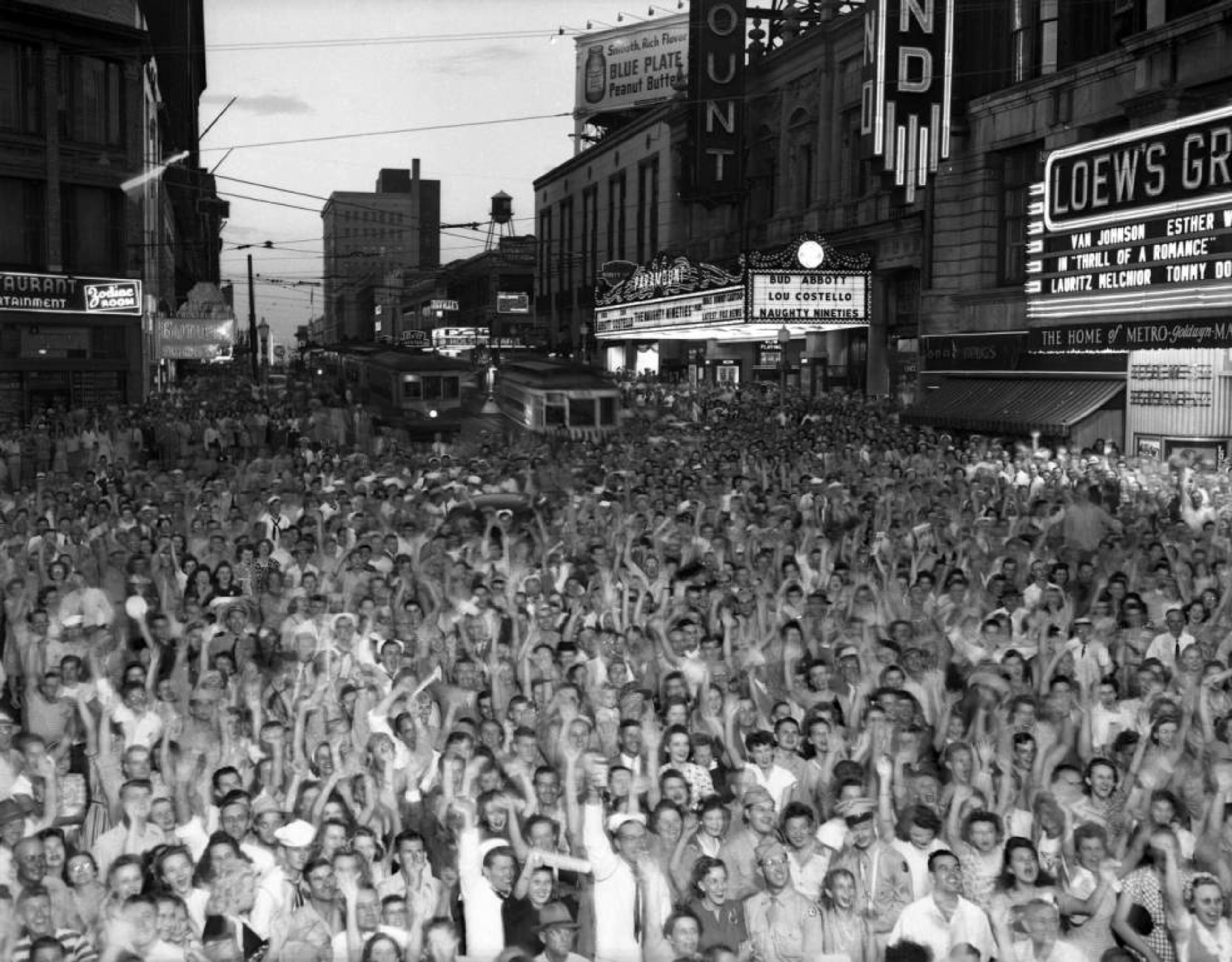 Soldiers and others celebrate V-J Day ("Victory over Japan Day") on Peachtree Street in Atlanta on August 14, 1945.