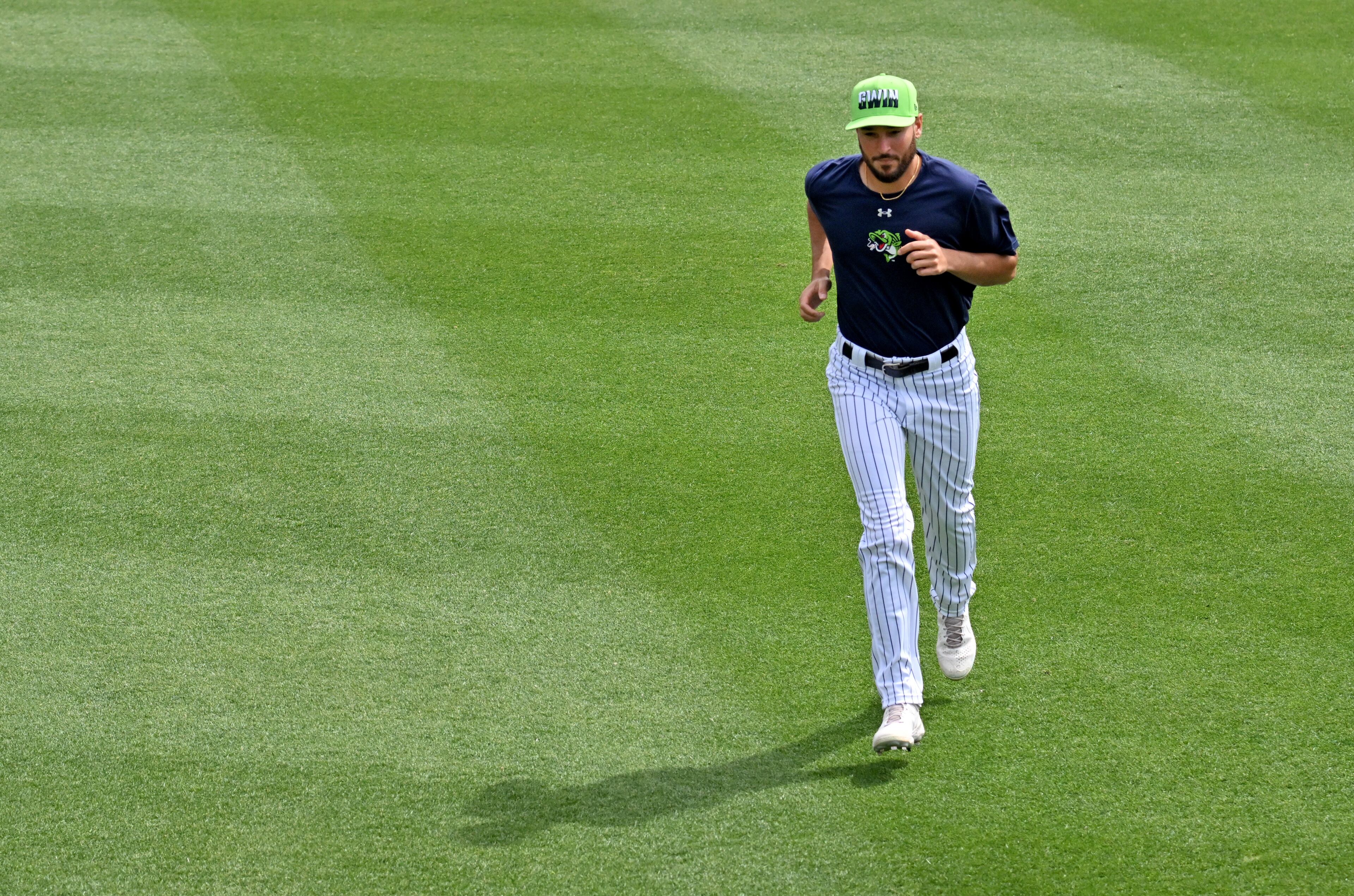 Gwinnett Stripers pitcher Danny Young jogs at Coolray Field. (Hyosub Shin / Hyosub.Shin@ajc.com)