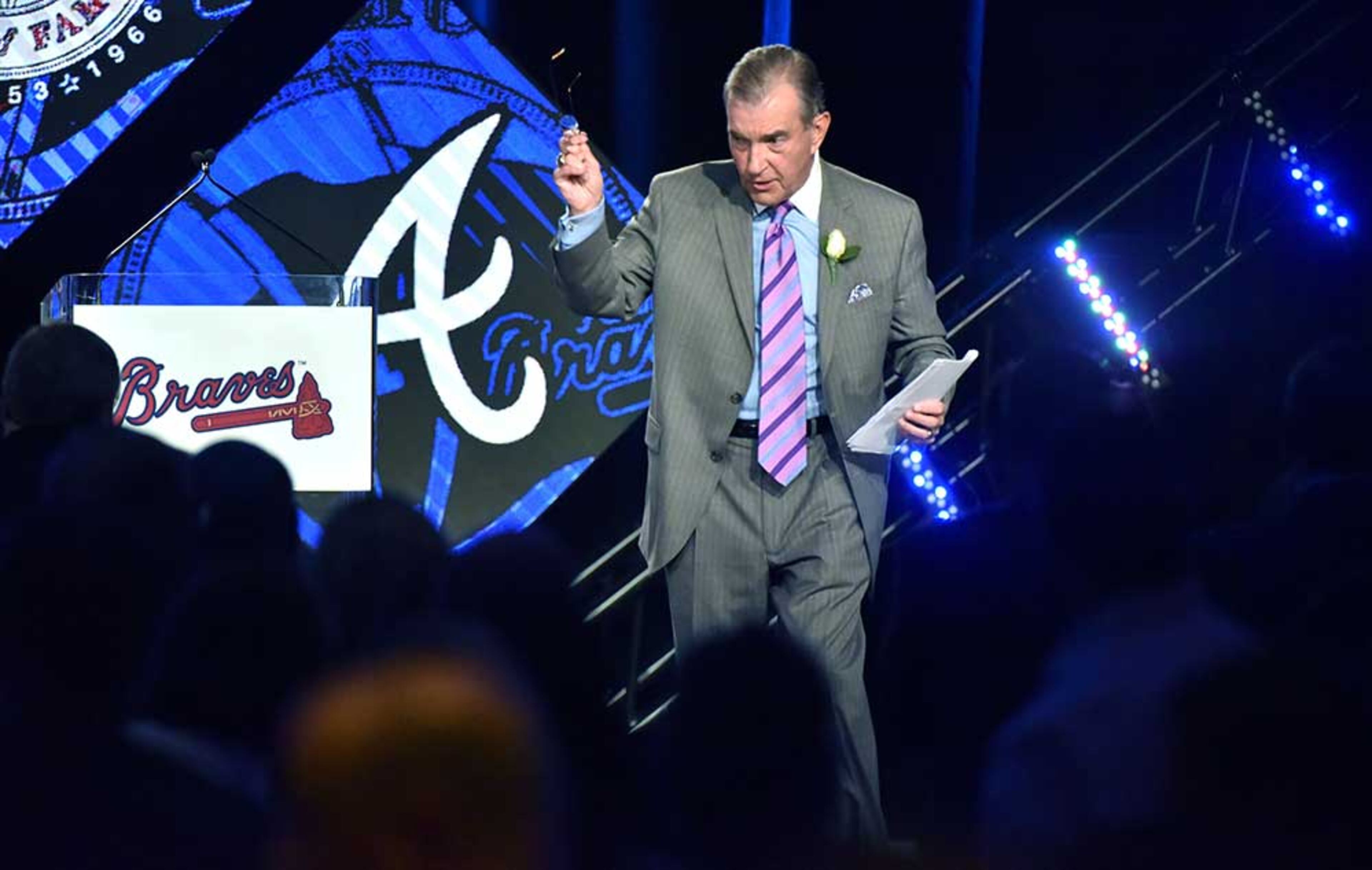 Atlanta Braves President John Schuerholz leaves the stage after he gave his acceptance speech during Braves Hall of Fame luncheon at Hyatt Regency on Friday, August 19, 2016. Atlanta Braves President John Schuerholz and former outfielder Andruw Jones were inducted into the Braves Hall of Fame. The duo were inducted during a luncheon and honored that evening in a pregame ceremony before the Braves play the Washington Nationals.
