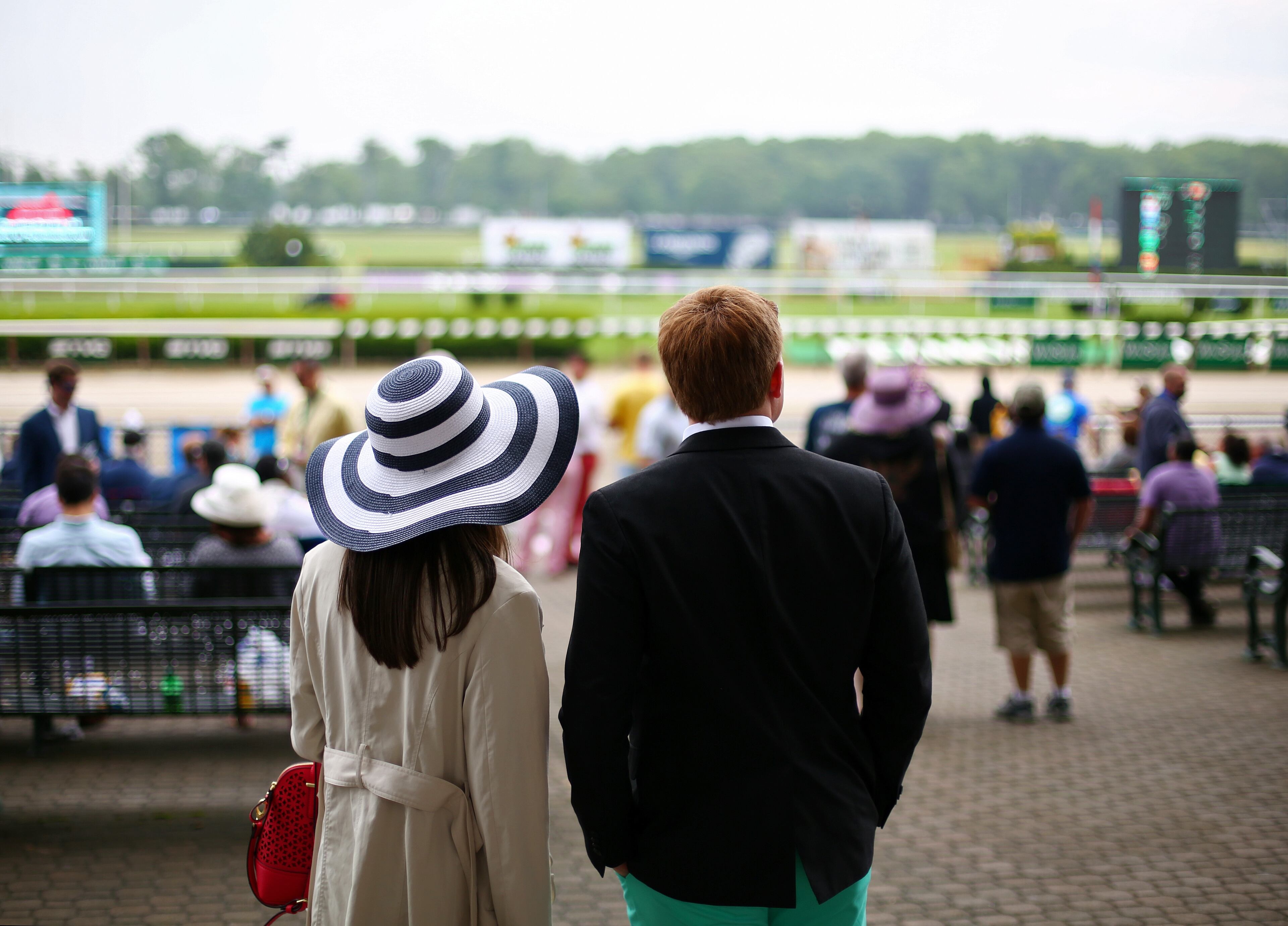 ELMONT, NY - JUNE 06: Race fans look on during the 147th running of the Belmont Stakes at Belmont Park on June 6, 2015 in Elmont, New York. (Photo by Michael Heiman/Getty Images)