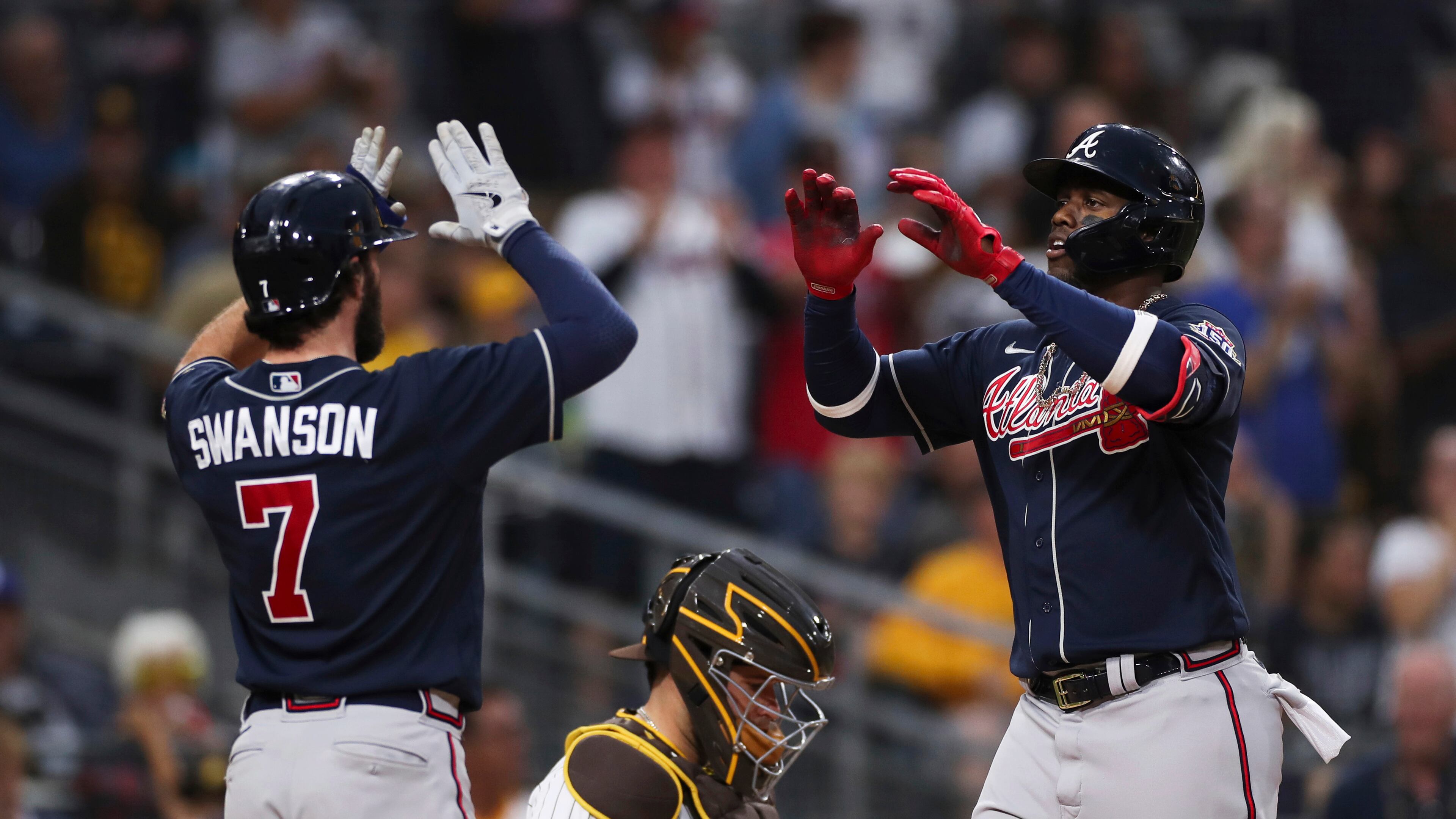 Braves' Jorge Soler, right, is congratulated by Dansby Swanson (7) after hitting a three-run home run against the San Diego Padres in the sixth inning of a baseball game Saturday, Sept. 25, 2021, in San Diego. (AP Photo/Derrick Tuskan)