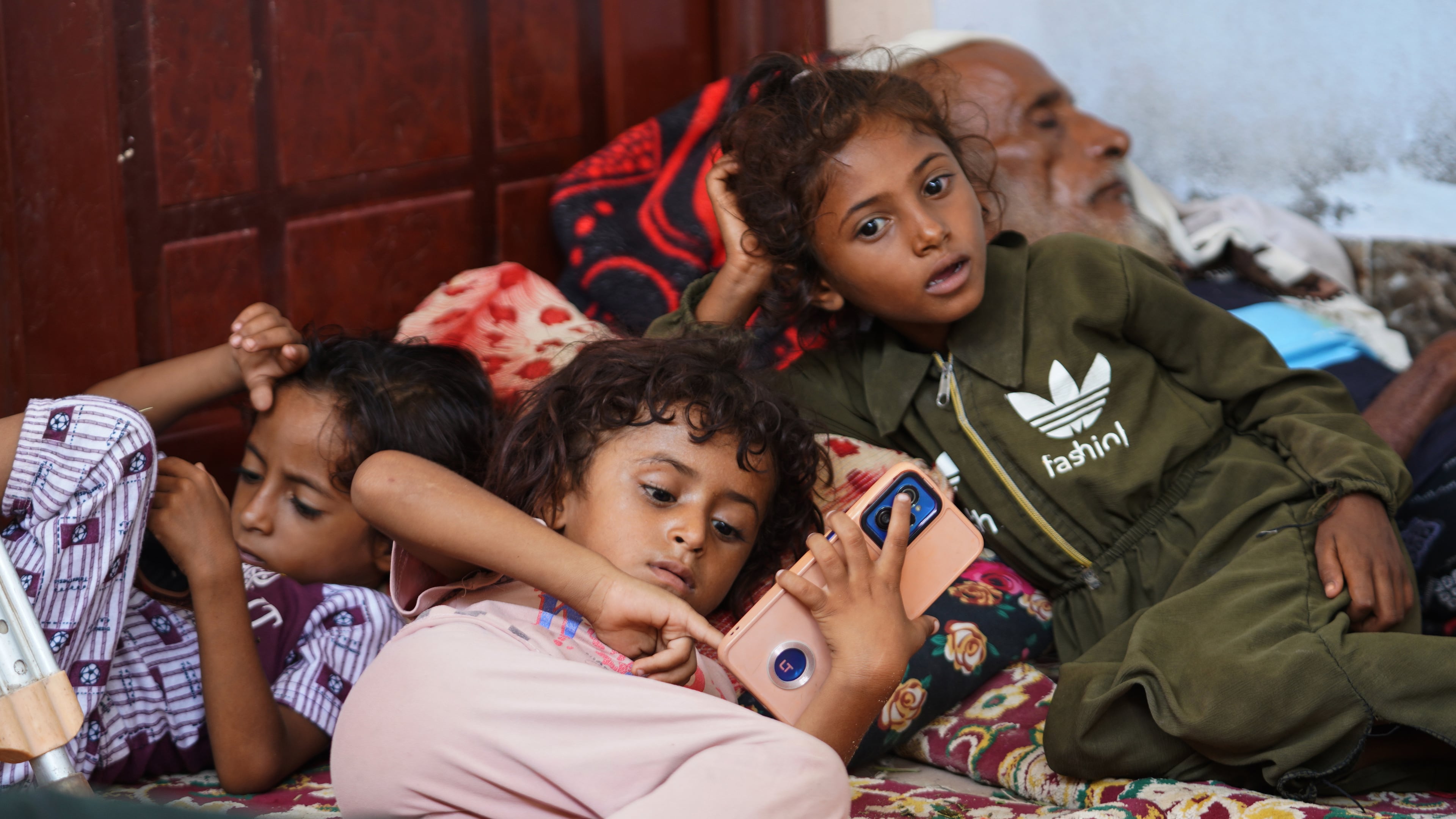 Displaced Yemenis rest at a temporary shelter in the Dar Saad district of Aden, Yemen, Saturday, Sept. 12, 2026, after fleeing Houthi attacks in the western coastal cities of al-Khokha and Mokha. (AP Photo/Abdulnasser Alseddik)