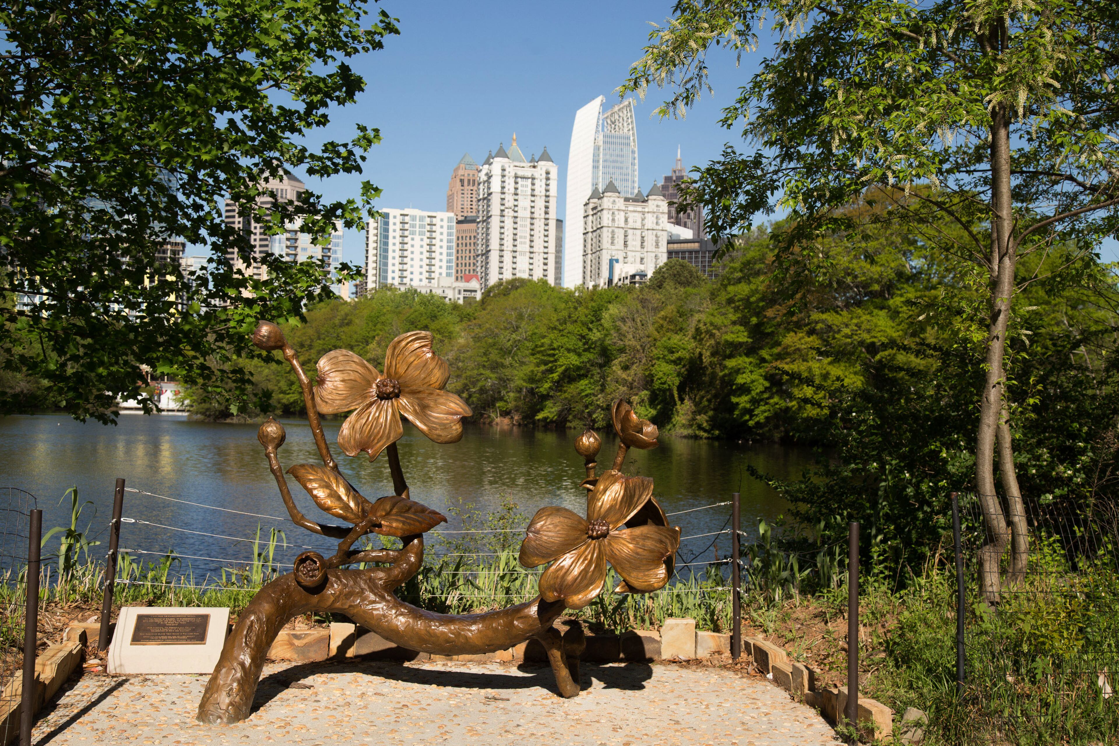 A large bronze sculpture shaped as a giant dogwood limb is on display during the 81st Annual Atlanta Dogwood Festival Saturday in Atlanta, Ga April 8, 2017. STEVE SCHAEFER / SPECIAL TO THE AJC