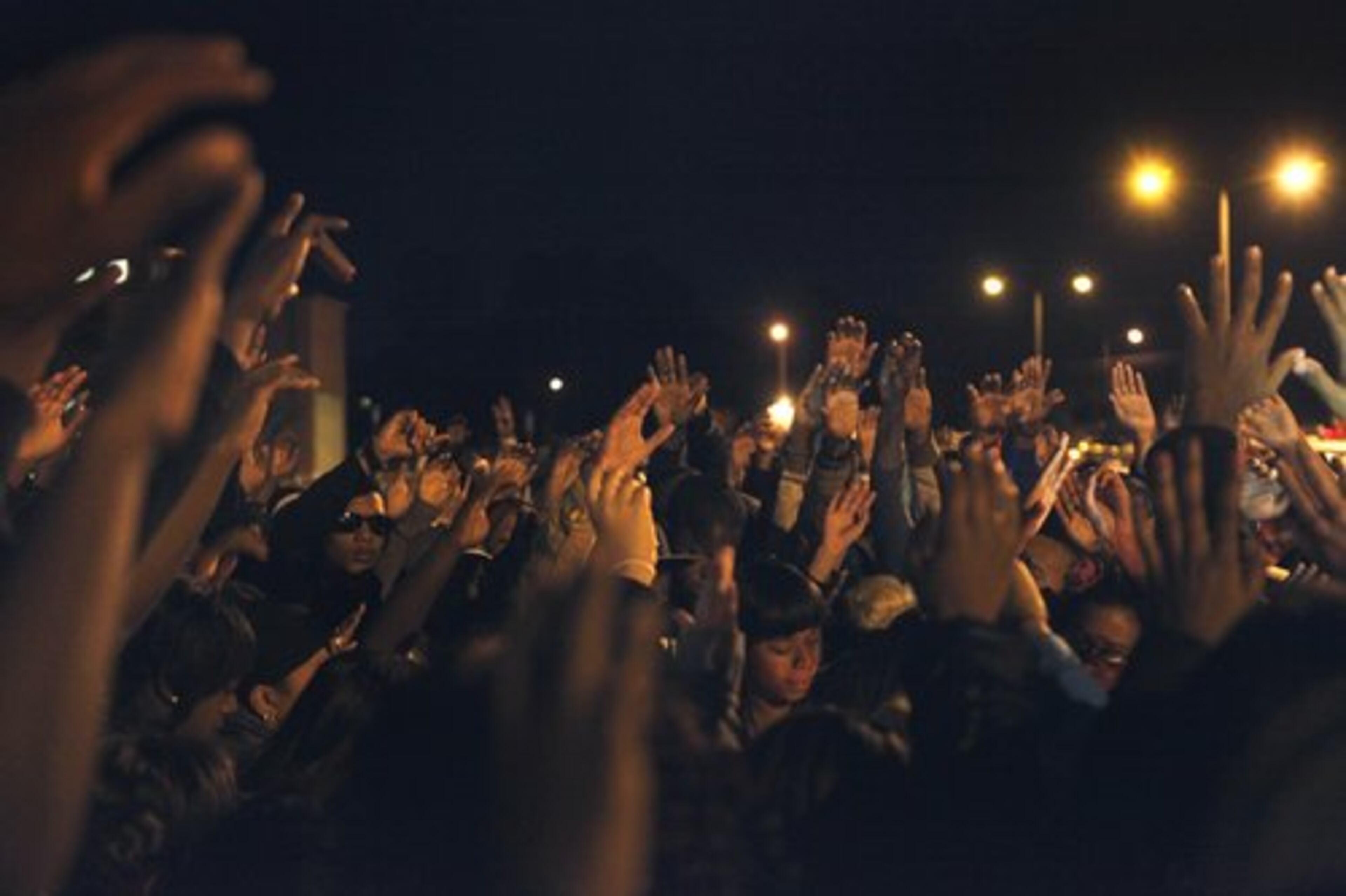 Students from Chapel Hill High School and rival Douglas County High School hold hands up in prayer. District Attorney David McDade said the crime, witnessed by dozens of young bystanders, is among the most heinous of his 30-year career.