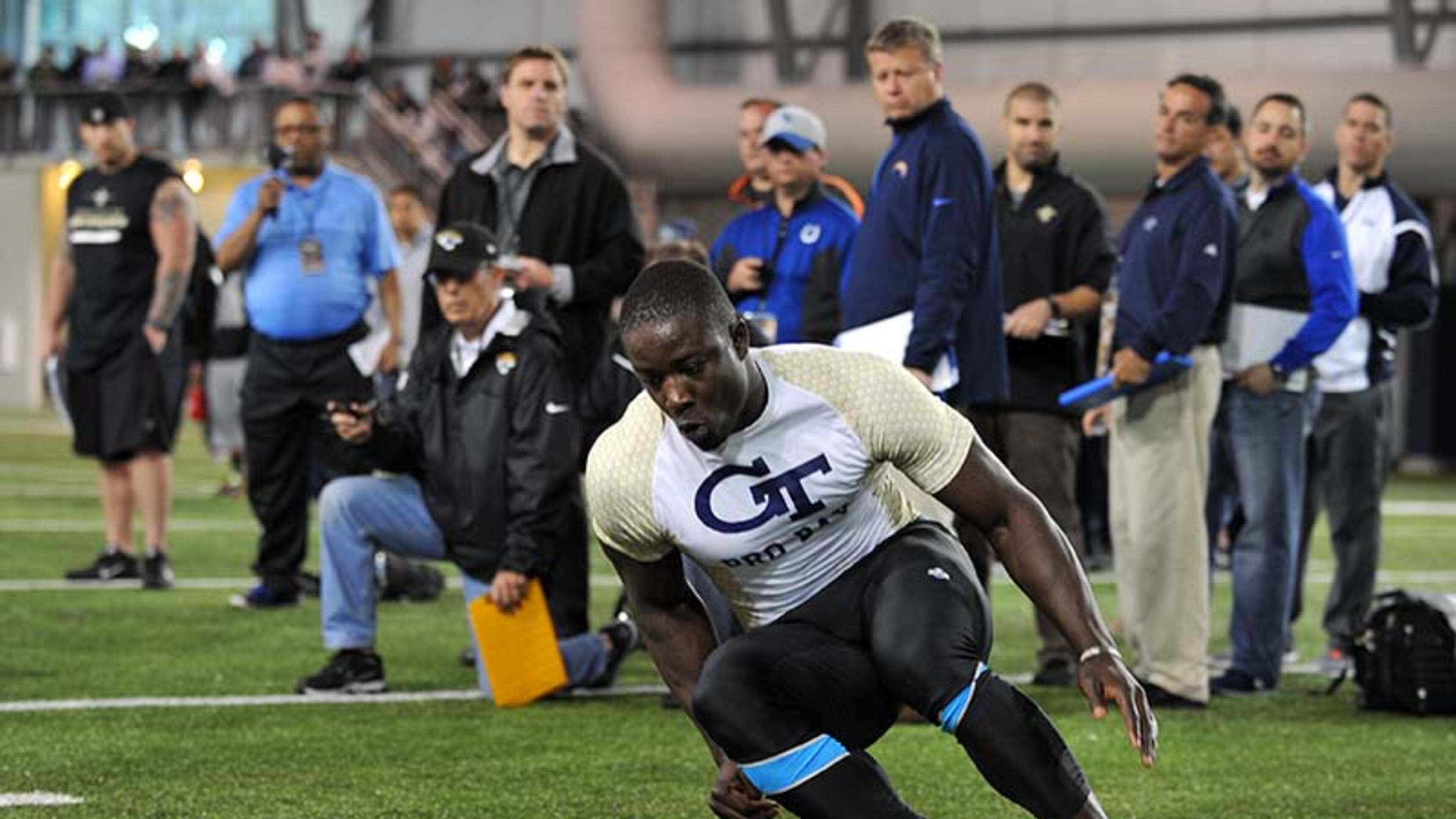 Georgia Tech linebacker Jeremiah Attaochu performs a drill in front of NFL scouts Friday, March 28, 2014, during Pro Day on the Georgia Tech campus in Atlanta.