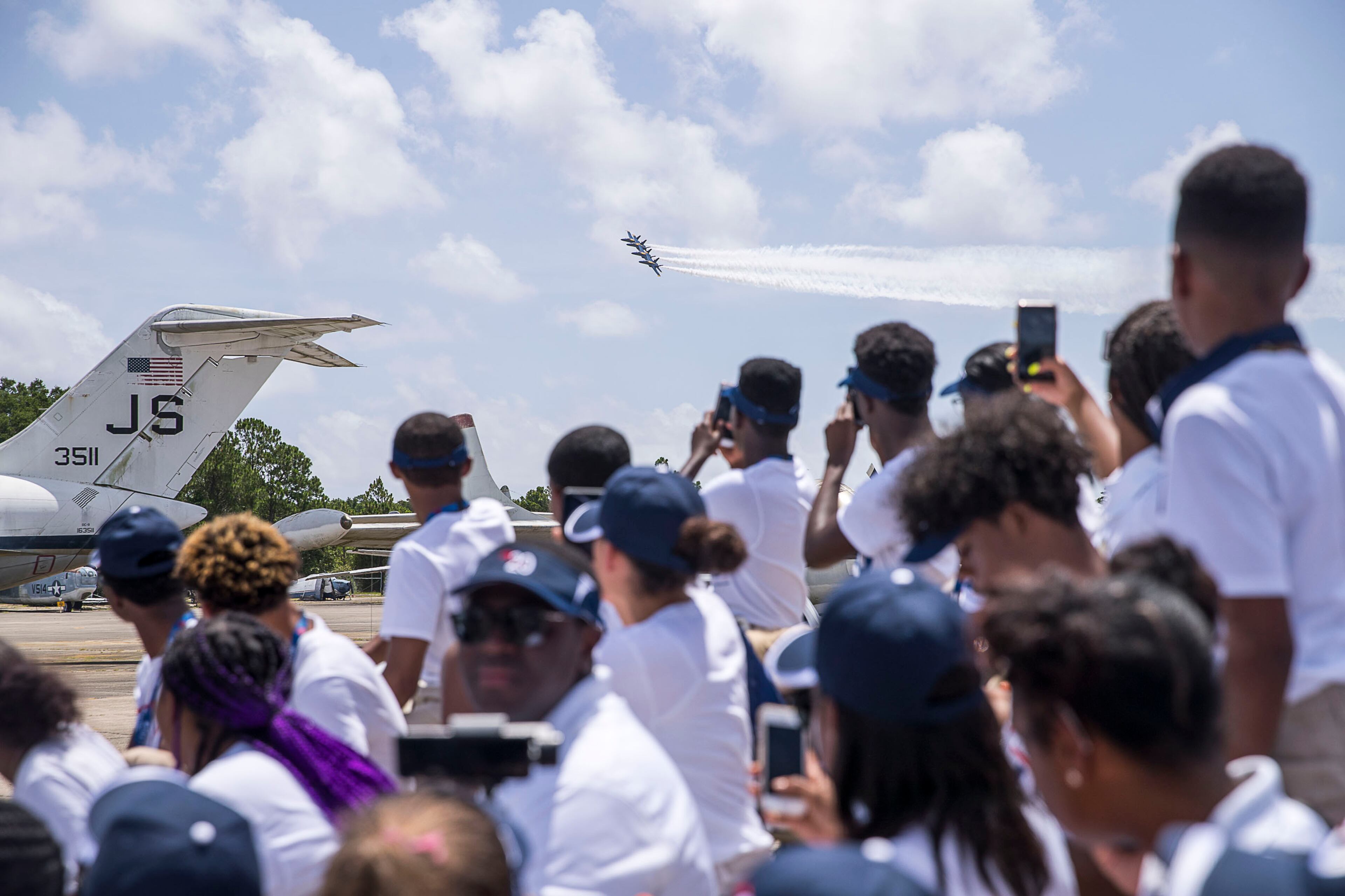 7/16/2019 -- Pensacola, Florida -- Delta Air Lines "dream flight' students watch as the United States Navy Blue Angels perform at the National Navy Aviation Museum in Pensacola, Tuesday, July 16, 2019. (Alyssa Pointer/alyssa.pointer@ajc.com)
