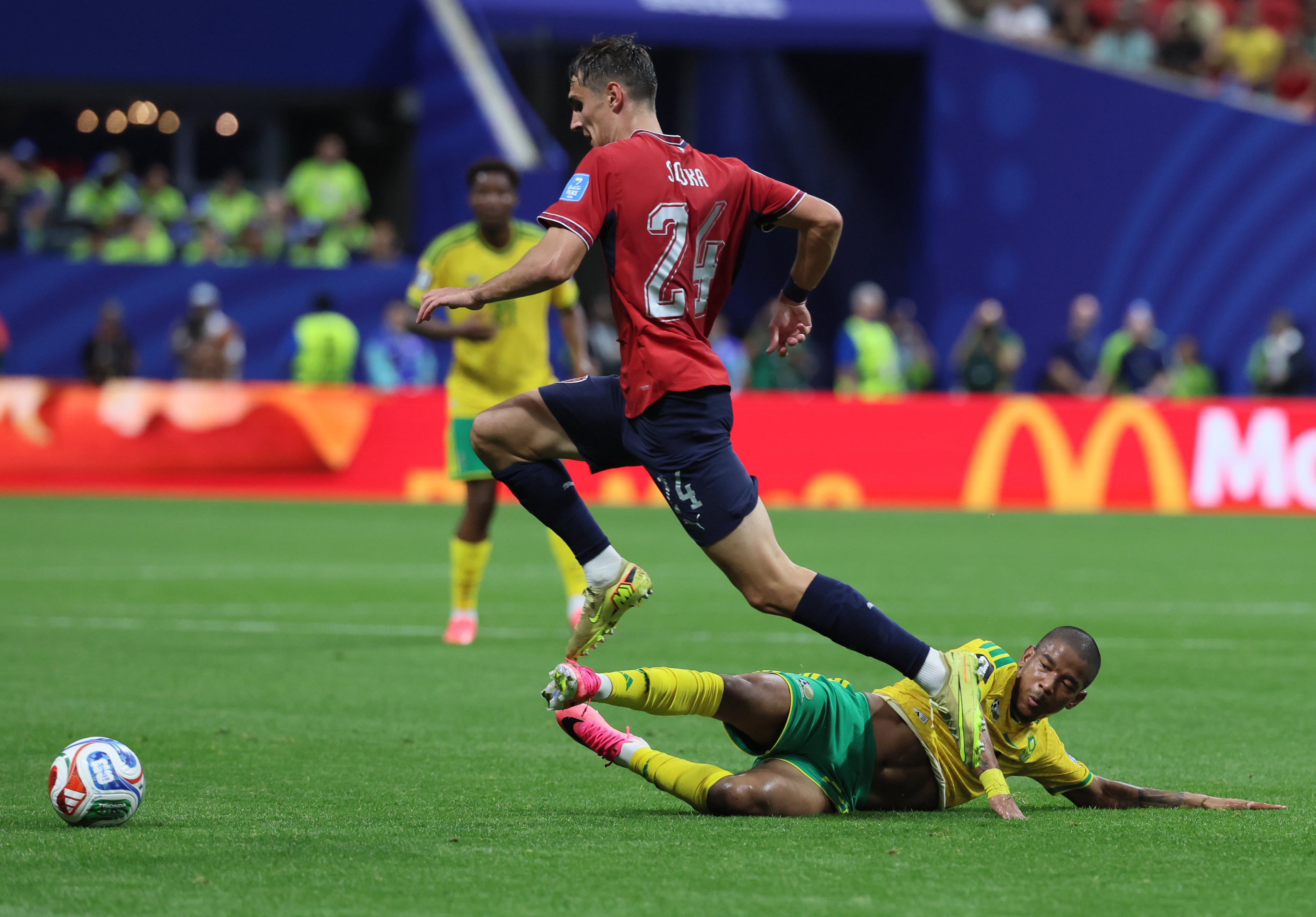 South Africa's Jayden Adams (bottom) slides to try to get the ball from Czechia's Alexandr Sojka during the first half of the Czechia vs. South Africa game at the FIFA World Cup at Atlanta Stadium on Thursday, June 18, 2026. (Jason Getz/AJC)