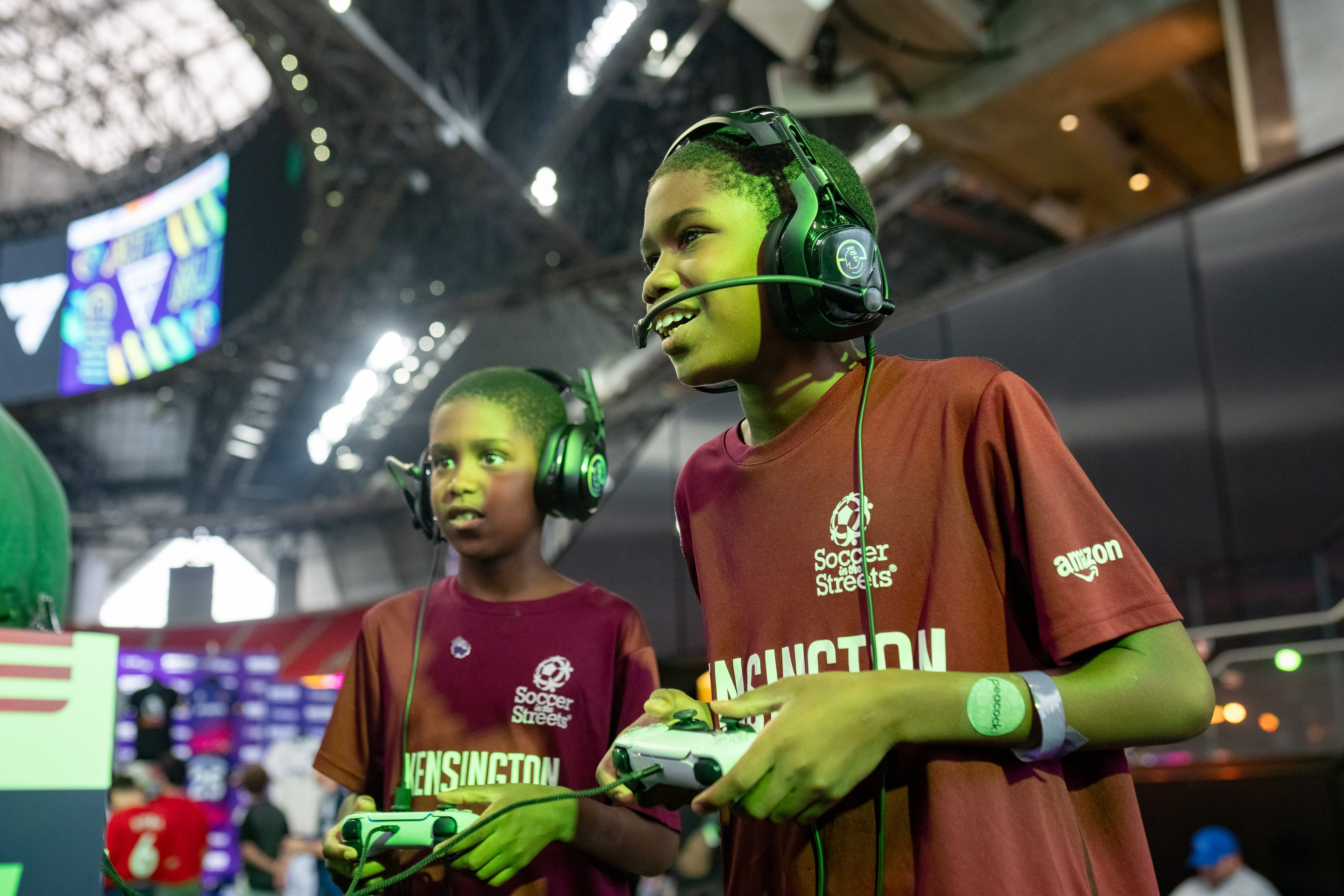 Suhaio Cooper (right), 11, plays EA Sports FC with his 8-year-old brother, Zubayr Cooper at the ePremier Fan Festival at Mercedes-Benz Stadium on Saturday, Aug. 2, 2025. (Ben Hendren for the AJC)