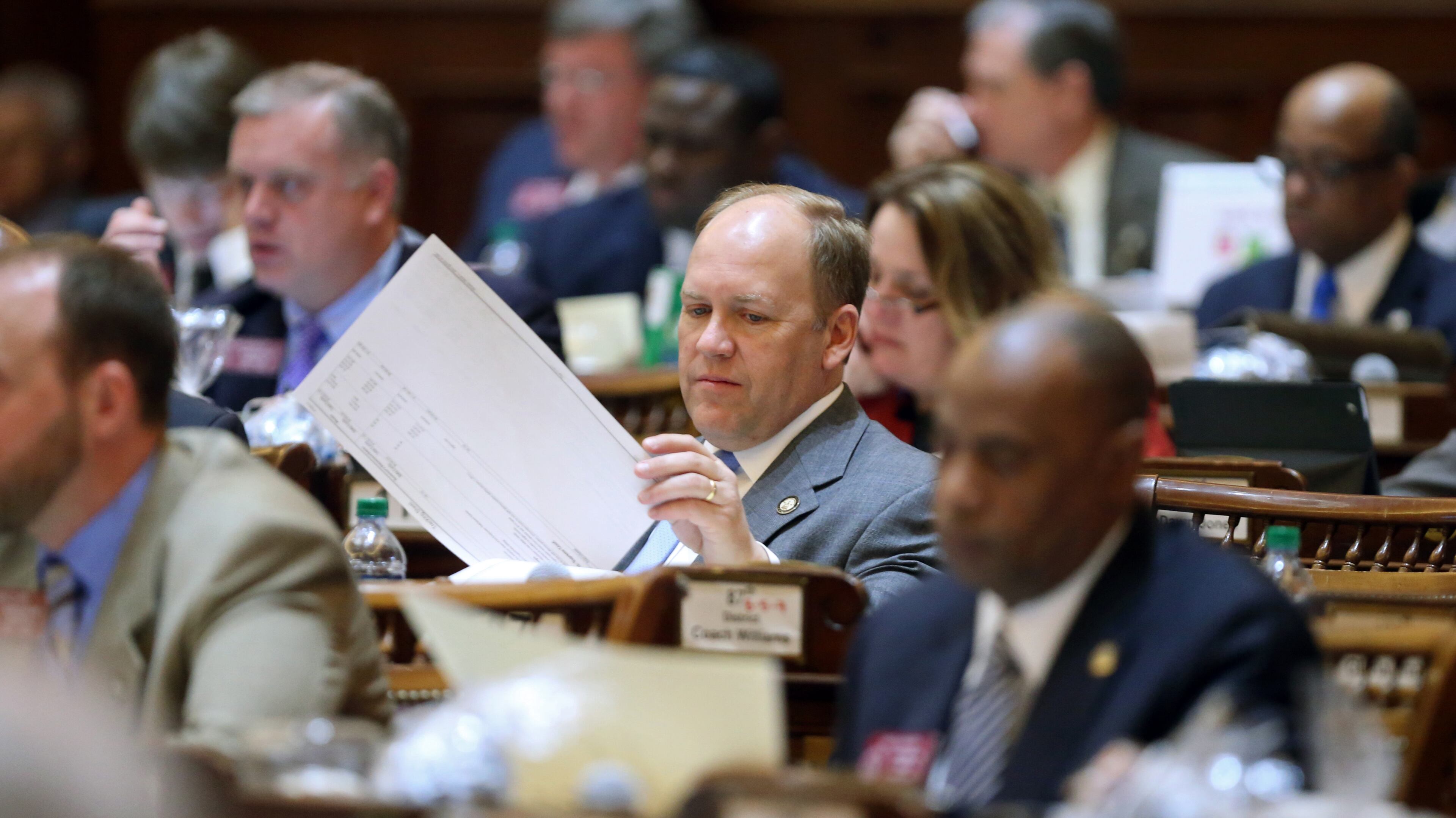 State Rep. Dan Gasaway, R-Homer, flips through the state budget in March 2013. A judge ruled Friday that a second do-over election will be held between Gasaway and Chris Erwin for House District 28. JASON GETZ / JGETZ@AJC.COM