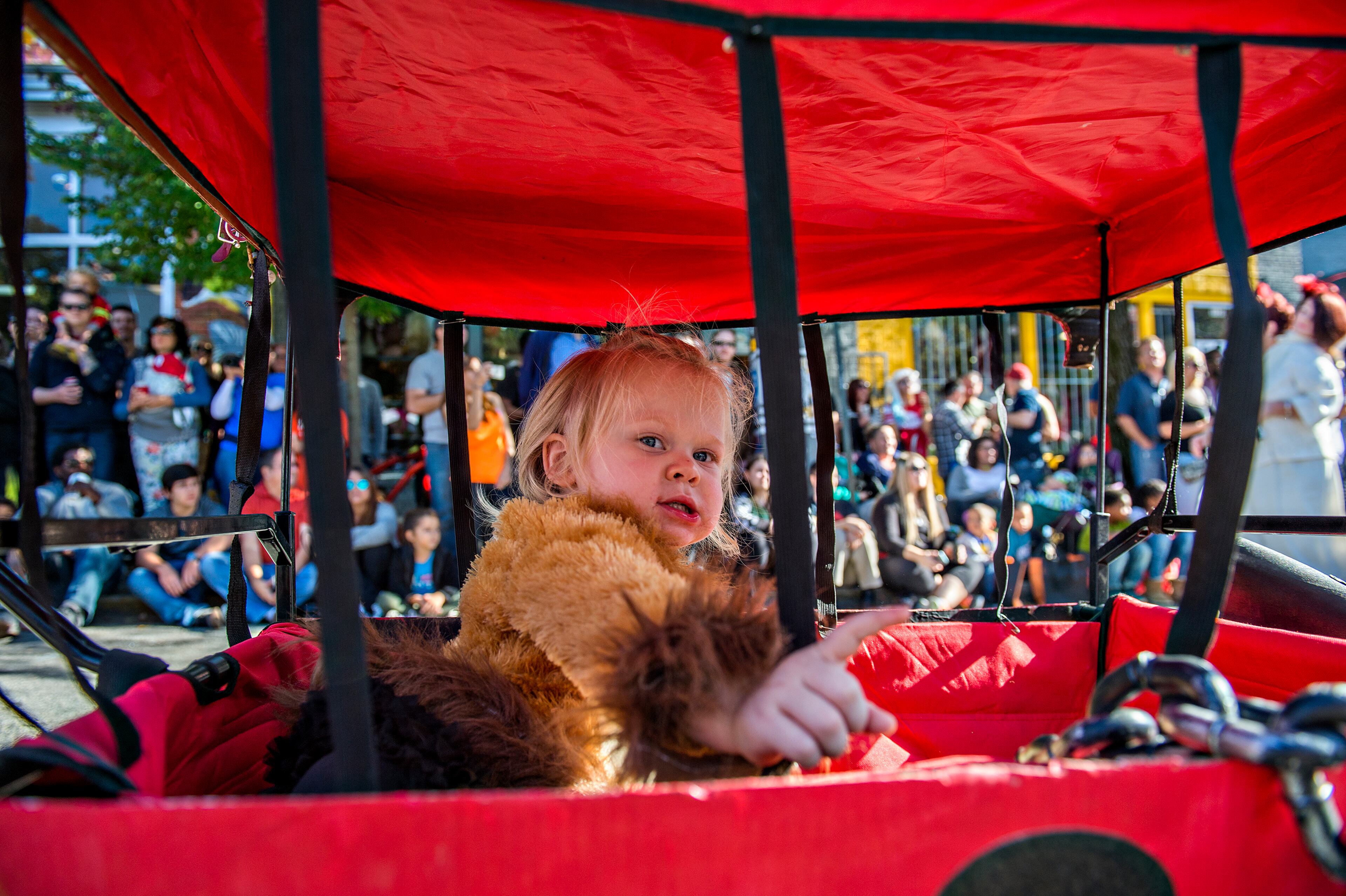 October 17, 2015 Atlanta - Tatum Bishop rides in her wagon during the Little Five Points Halloween Parade in Atlanta on Saturday, October 17, 2015. The annual parade brought out tens of thousands of people to watch the antics. JONATHAN PHILLIPS / SPECIAL