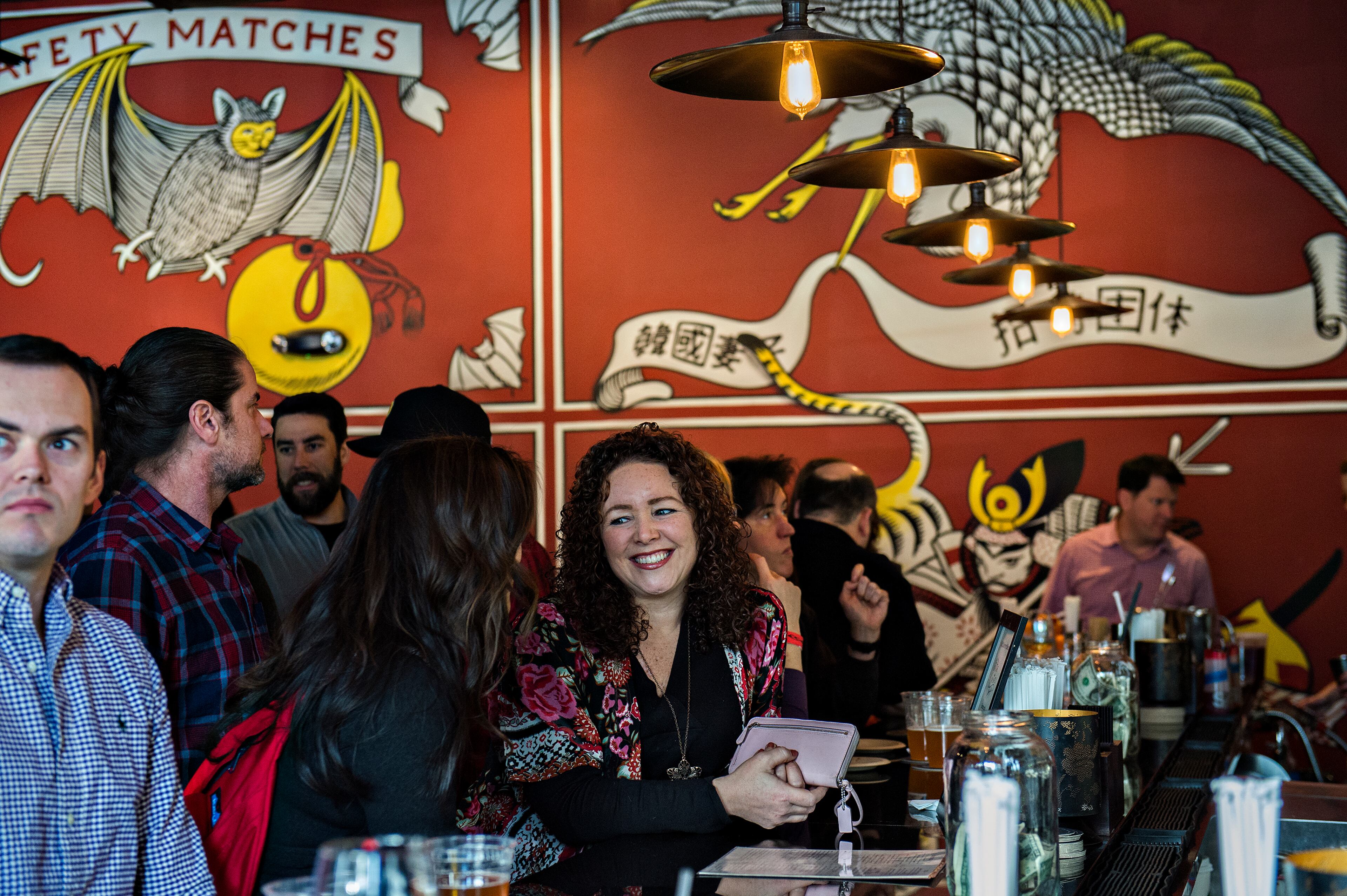 Jenny Osbon (center) talks to Michelle Jones during the Lunar New Year Celebration at Makan in Decatur on Saturday, Feb. 6, 2016. JONATHAN PHILLIPS / SPECIAL