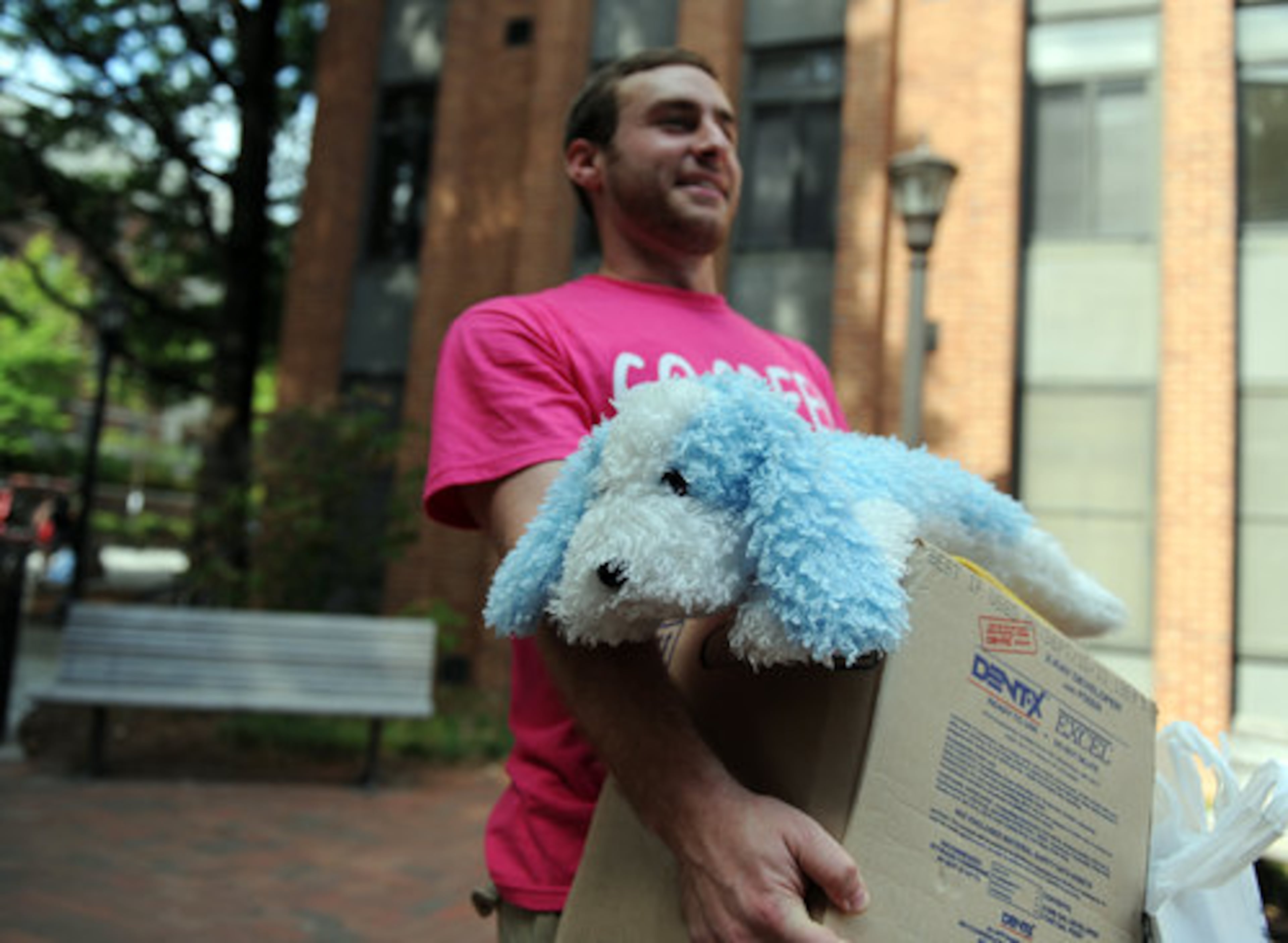Freshman Hyeji Park's stuffed dog gets a ride up from Greek Club member David Geisert.