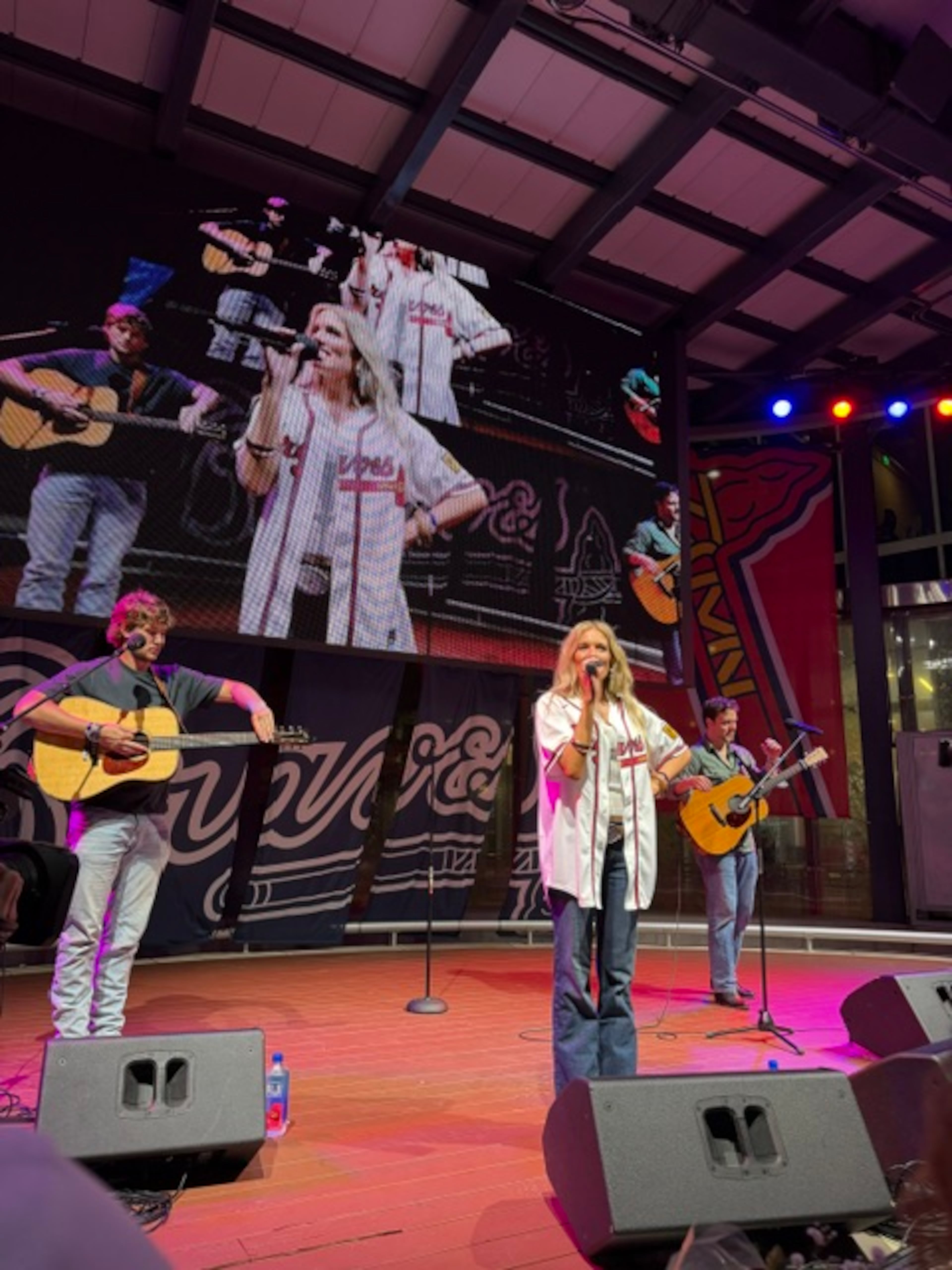 Hull native and rising country artist Mackenzie Carpenter performs a post-game concert in The Battery on April 28. (Gabriel Burns/AJC)