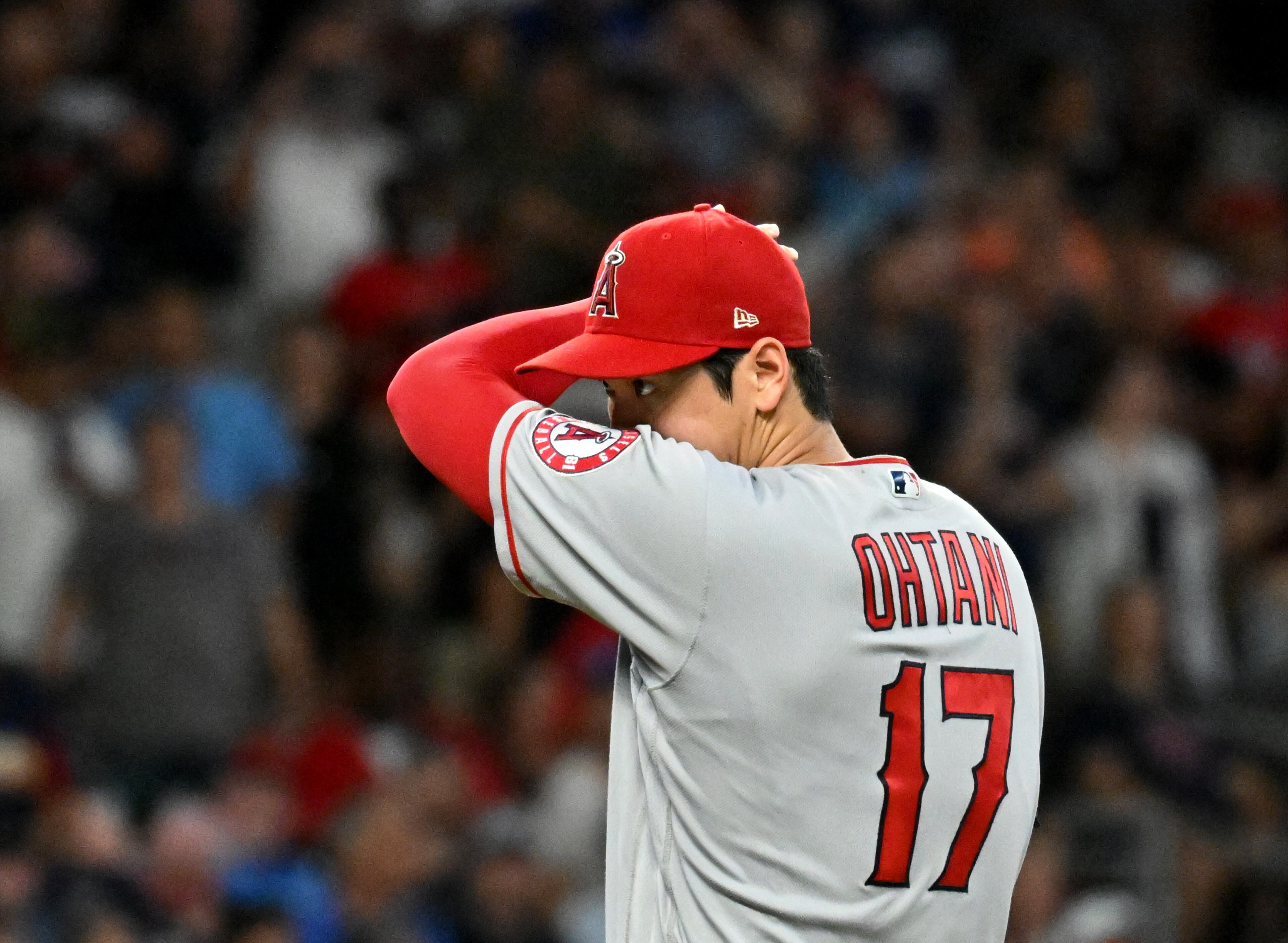 Los Angeles Angels' starting pitcher Shohei Ohtani (17) reacts after allowing an RBI single by Atlanta Braves' right fielder Eddie Rosario (8) in the 7th inning at Truist Park on Friday, July 22, 2022. Atlanta Braves won 8-1 over Los Angeles Angels. (Hyosub Shin / Hyosub.Shin@ajc.com)