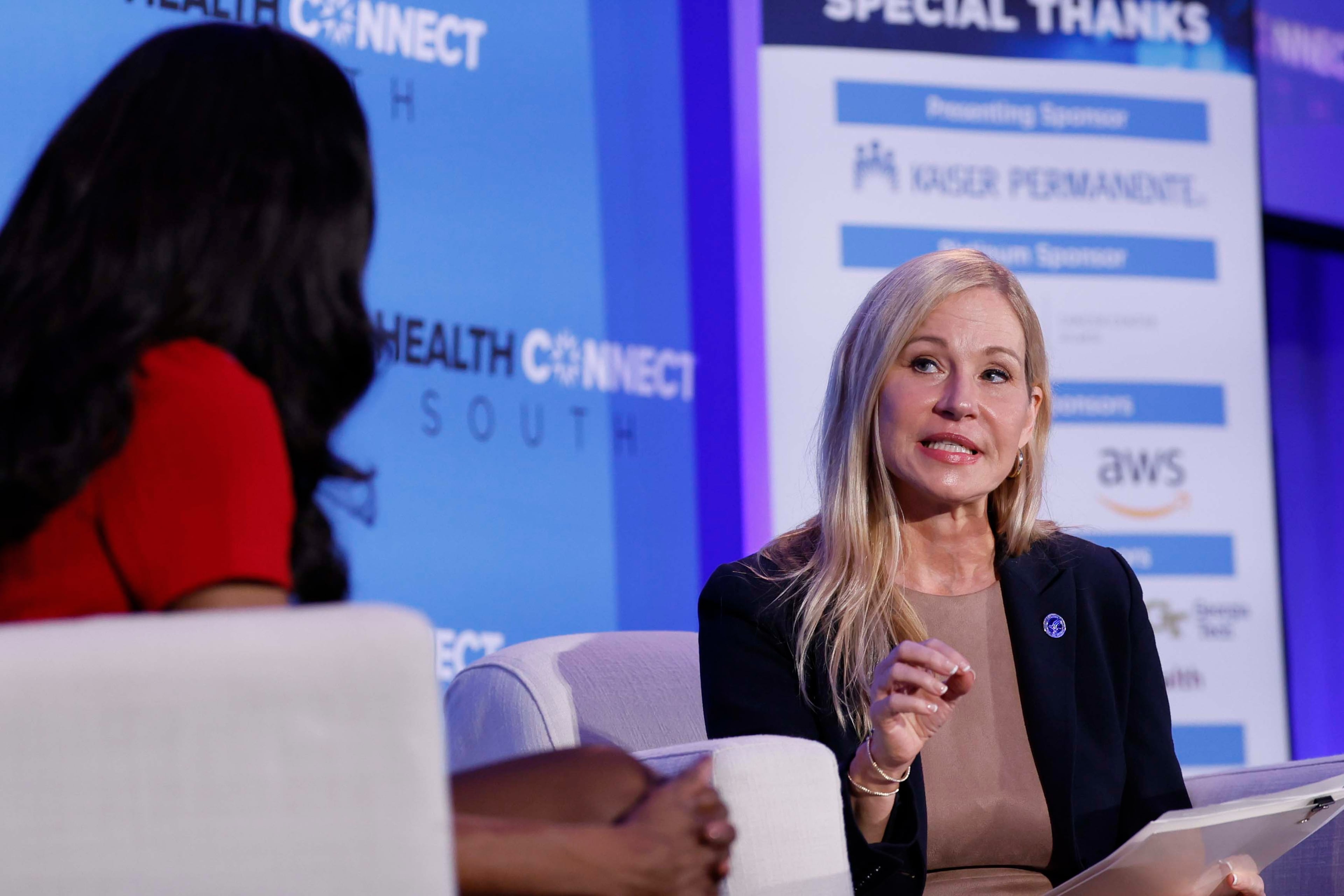 Samantha Brown-Parks, Regional Director of the U.S. Department of Health and Human Services, speaks with new CDC Director Erica Schwartz at the Health Connect South conference at the Georgia Aquarium on Wednesday, Sept. 16, 2026. (Miguel Martinez/AJC)