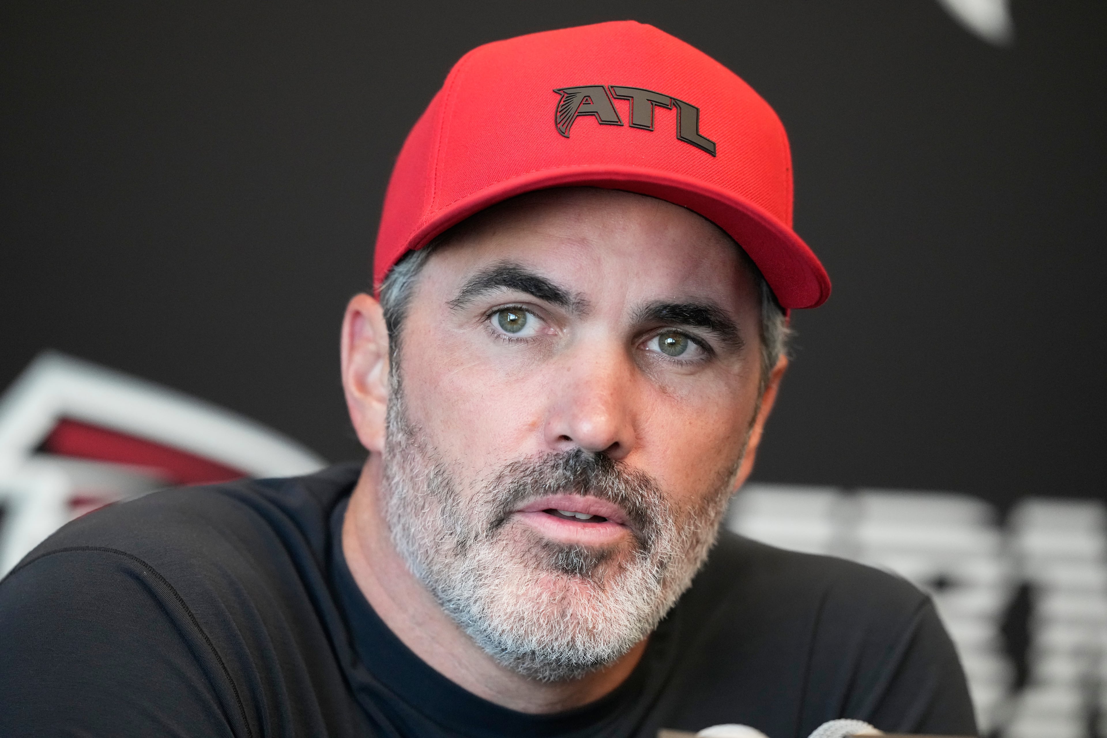 Falcons coach Kevin Stefanski, shown here speaking during a training camp practice in August, told reporters Wednesday the team could start any of their four active quarterbacks on Sunday. (Brynn Anderson/AP)
