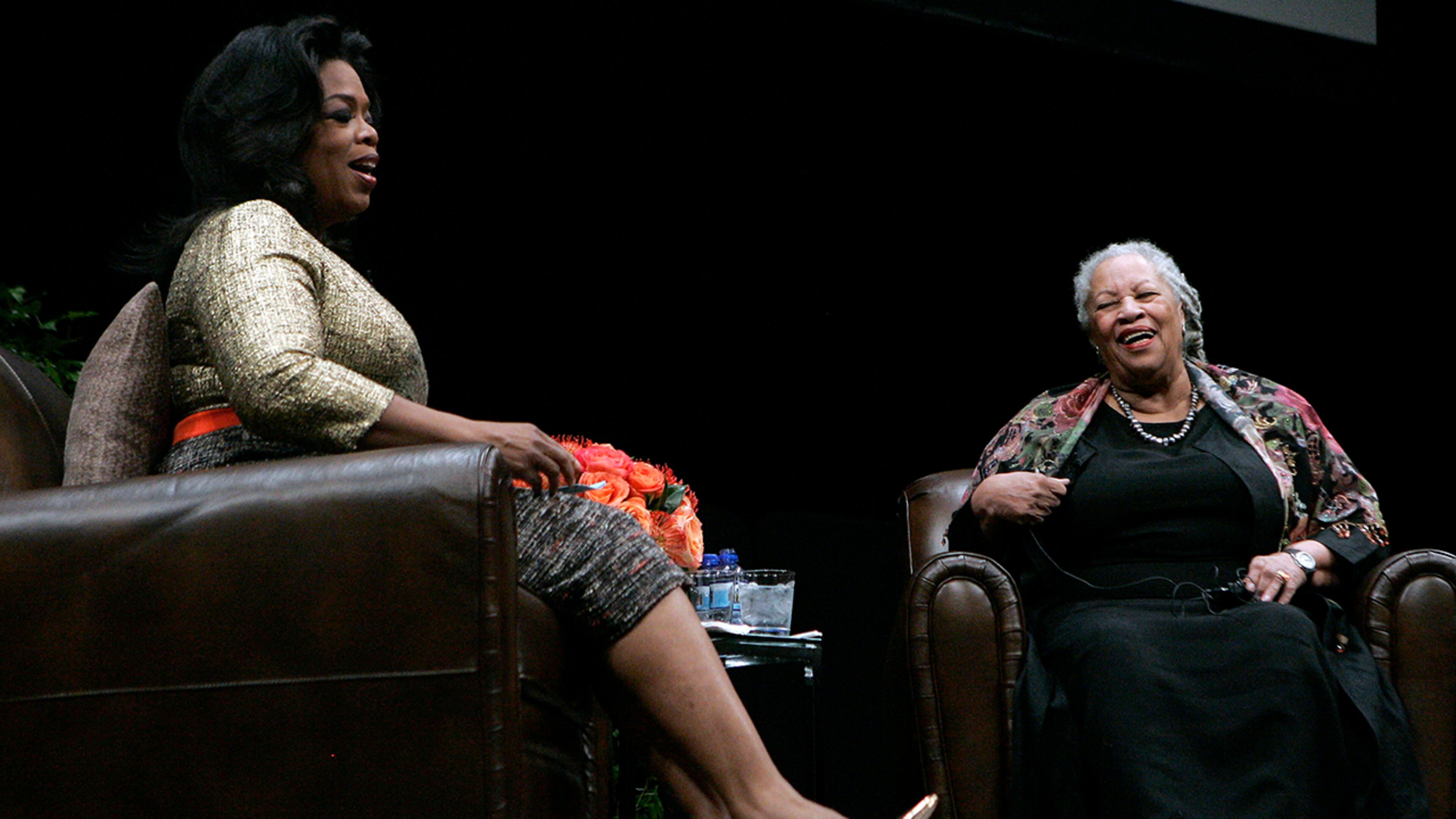 Toni Morrison (R) shares a laugh with Oprah Winfrey during the annual Carl Sandburg Literary Awards Dinner October 20, 2010, in Chicago.