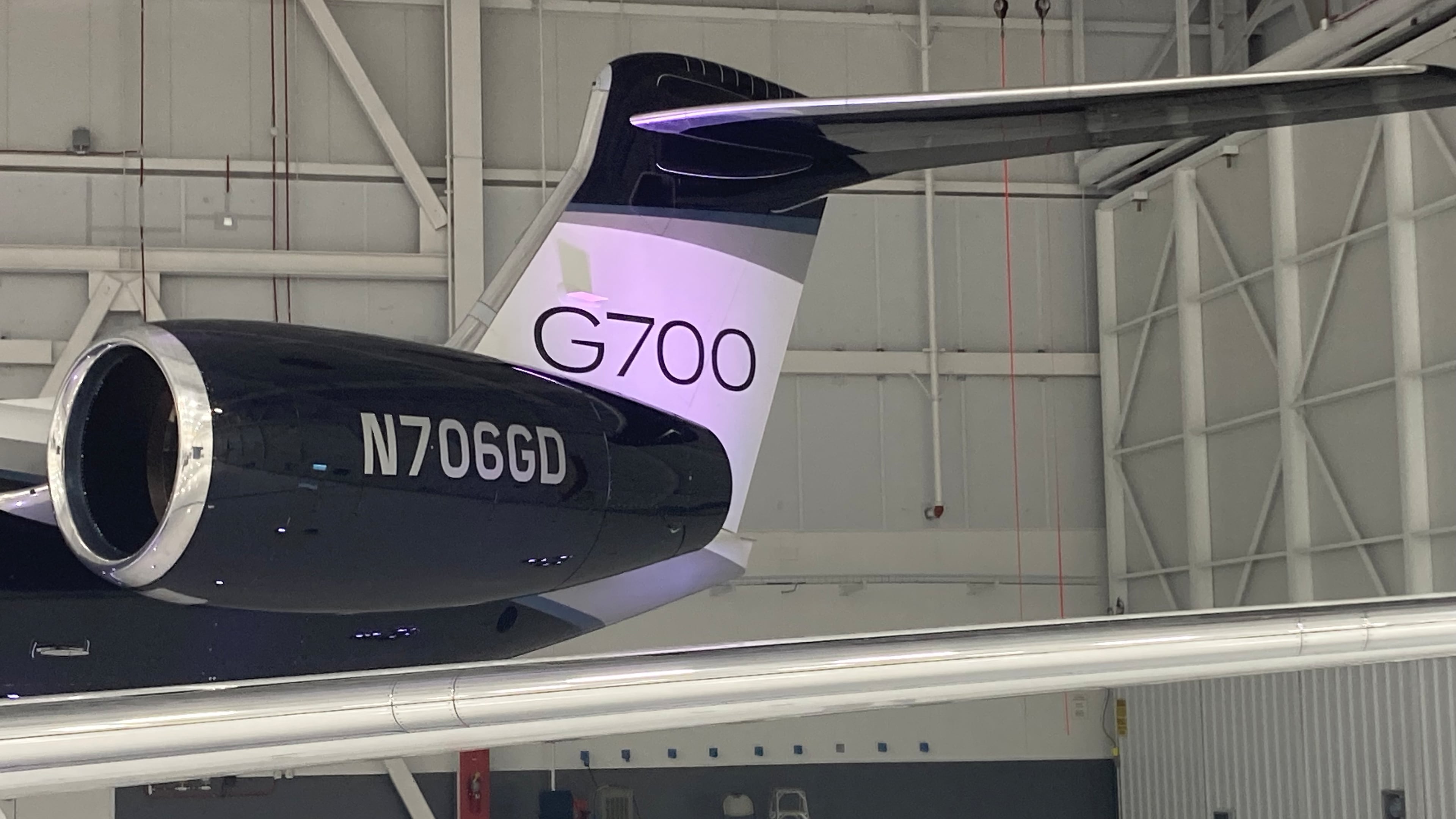 A flight test model of the Gulfstream G700 sits in a maintenance hangar at the Gulfstream Savannah Service Center East. (Adam Van Brimmer/AJC)