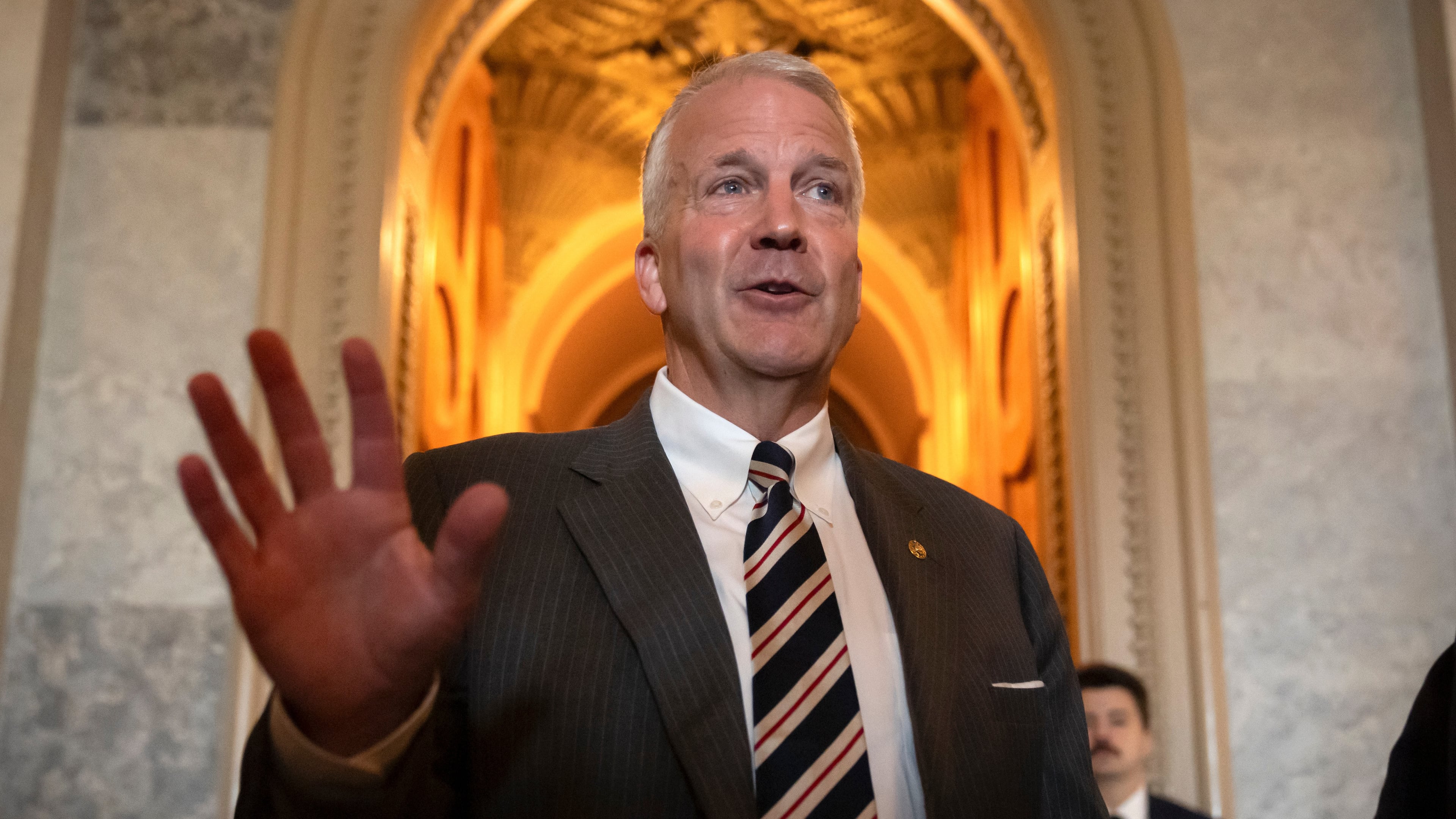 FILE - Sen. Dan Sullivan, R-Alaska, speaks to reporters at the Capitol in Washington, June 30, 2025. (AP Photo/Mark Schiefelbein)