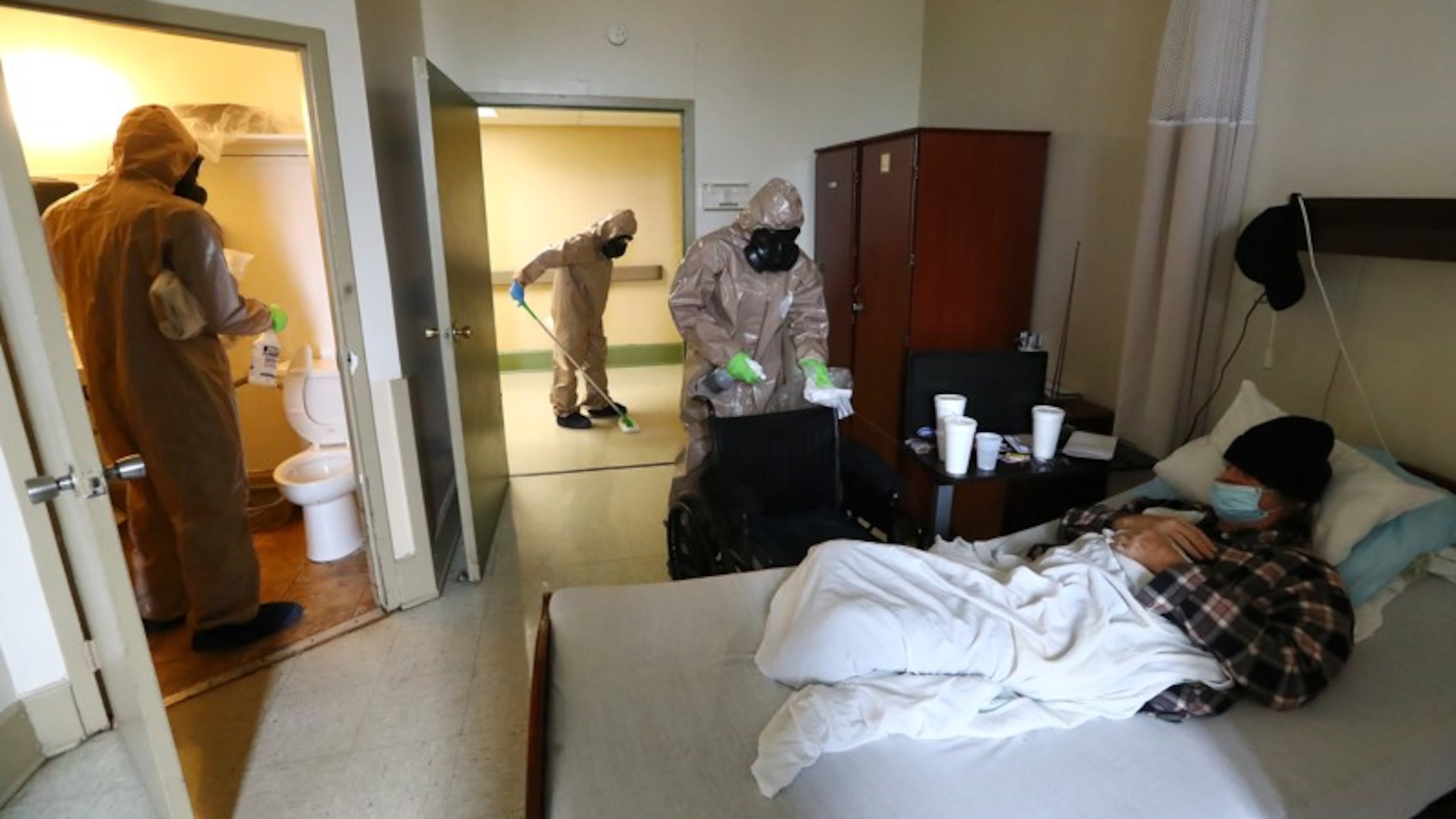 Members of the Georgia Army National Guard disinfect a resident's room at the Legacy Transitional Care last month in Atlanta.