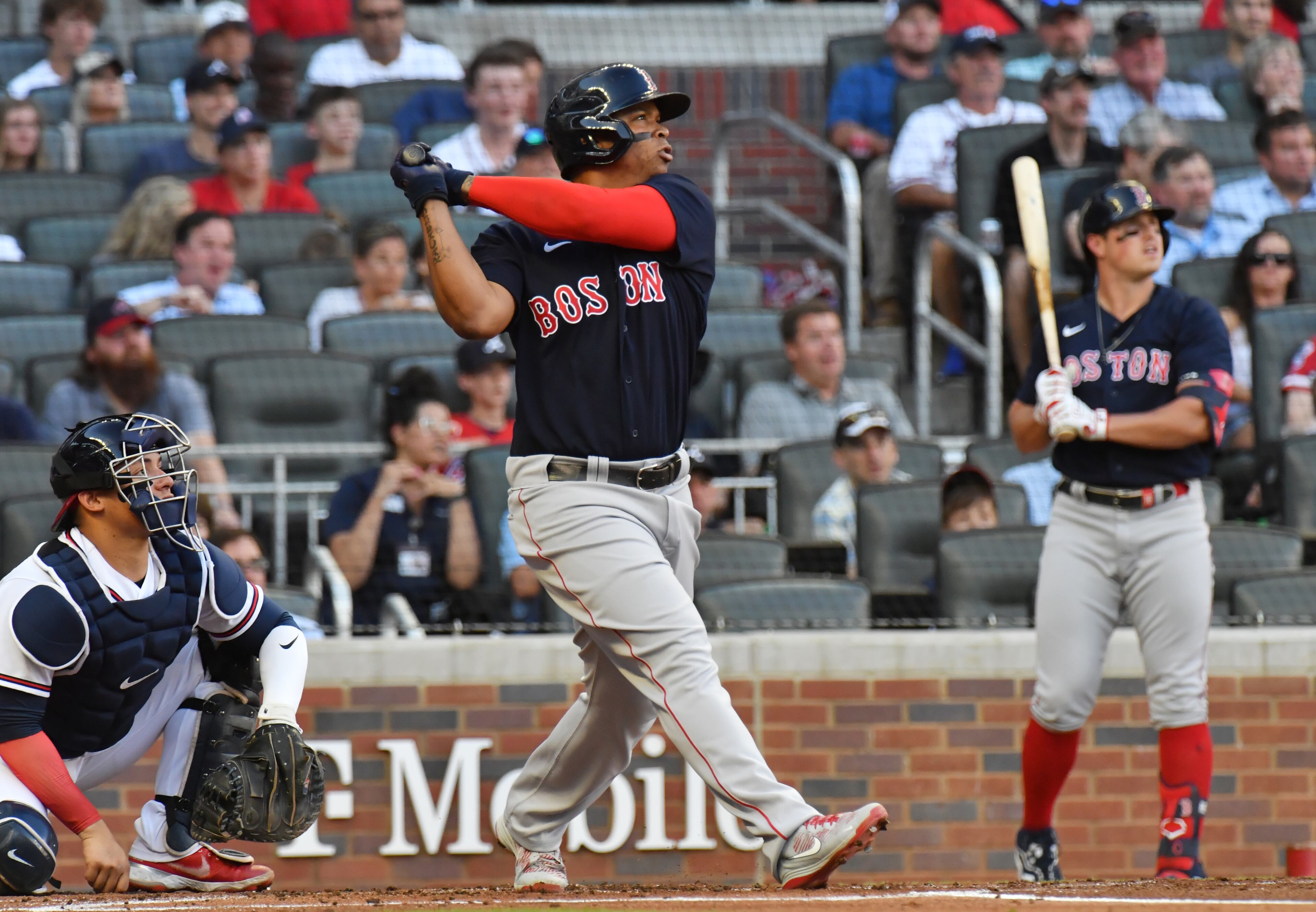Red Sox third baseman Rafael Devers follows through on his three-run homer in the first inning off Tucker Davidson.