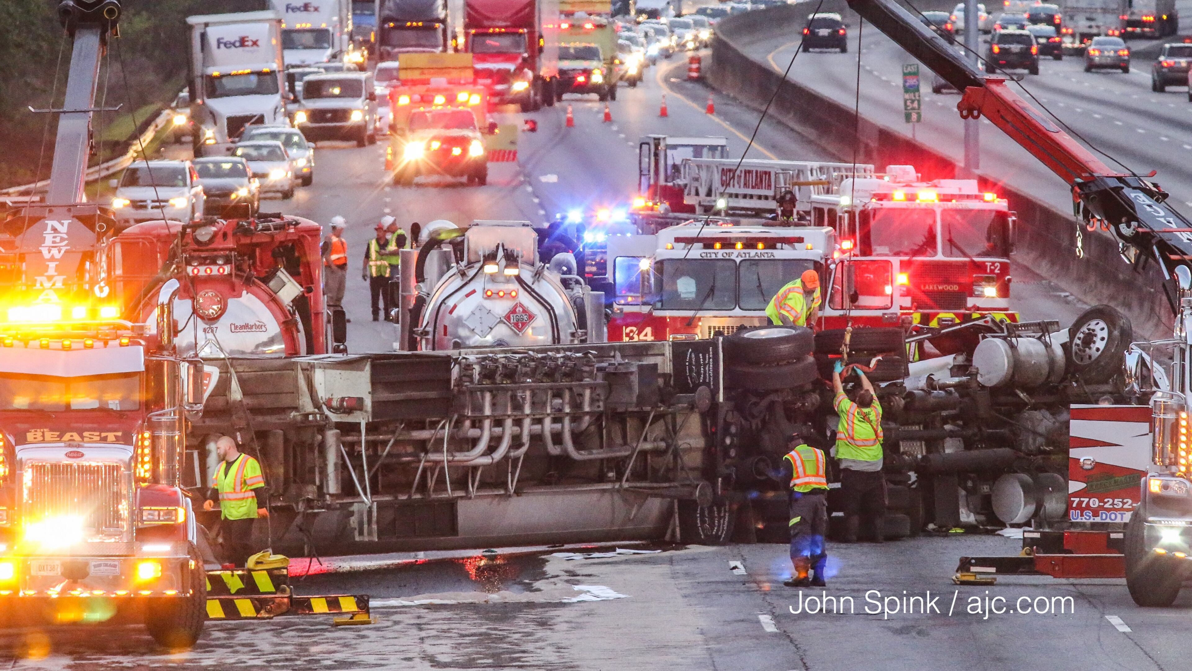 A tanker truck crash and fuel spill has I-285 shut down in both directions. JOHN SPINK / JSPINK@AJC.COM