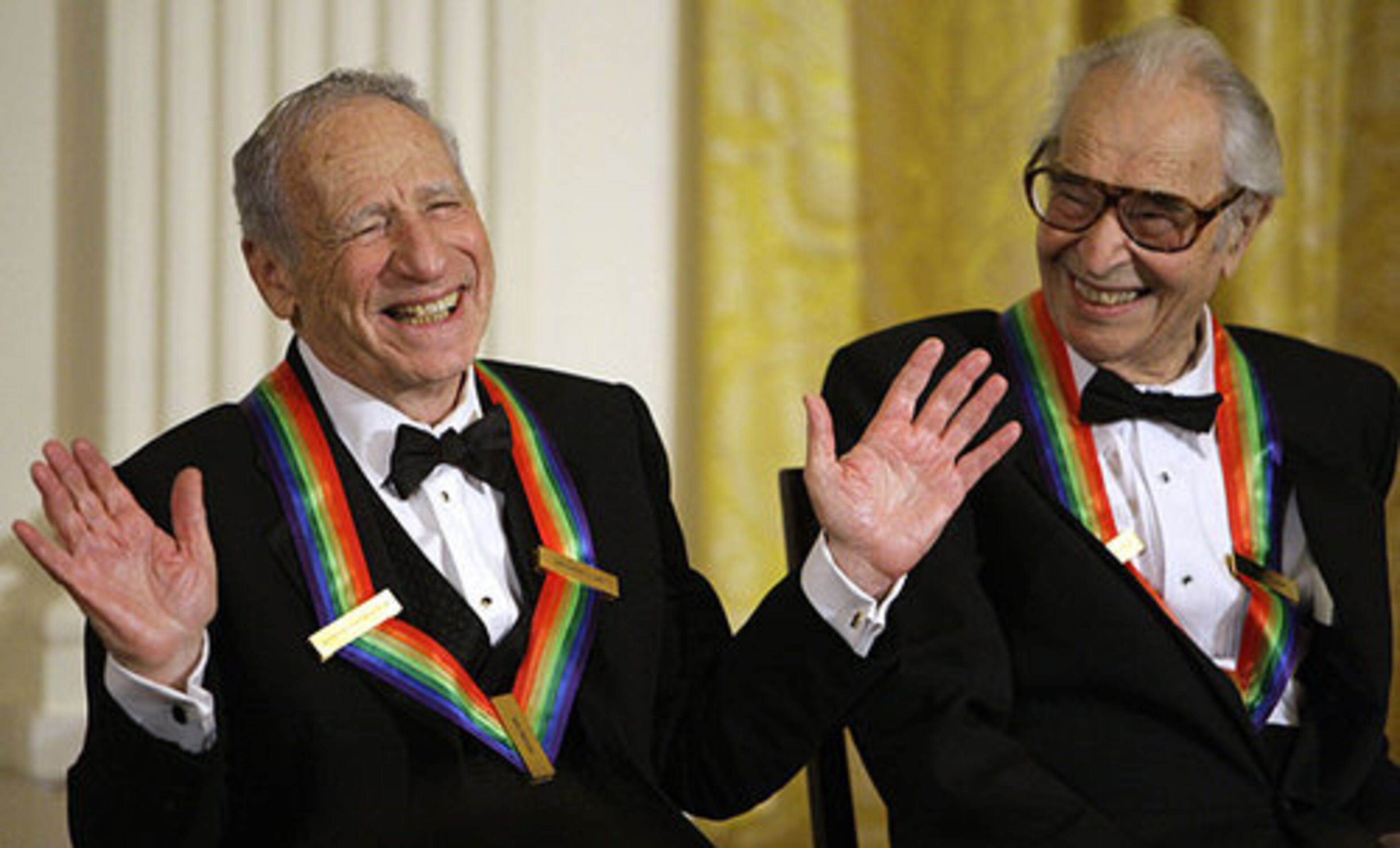 Kennedy Center honorees Mel Brooks, left, works the crowd as Dave Brubeck laughs in the East Room.