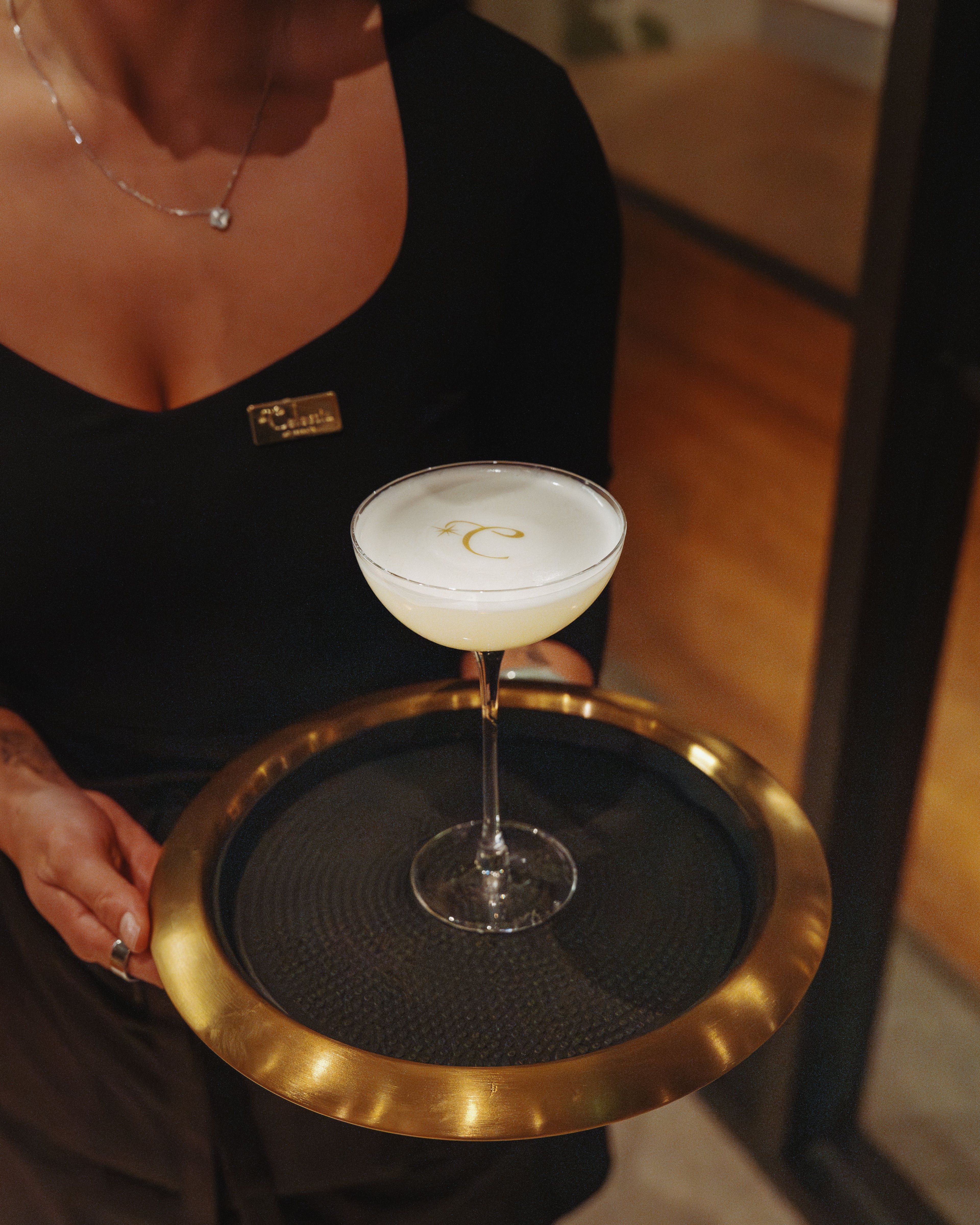 Celestia's kyokai nova cocktail is topped with an edible version of the restaurant's logo. (Adrian Profumo, courtesy of Celestia)