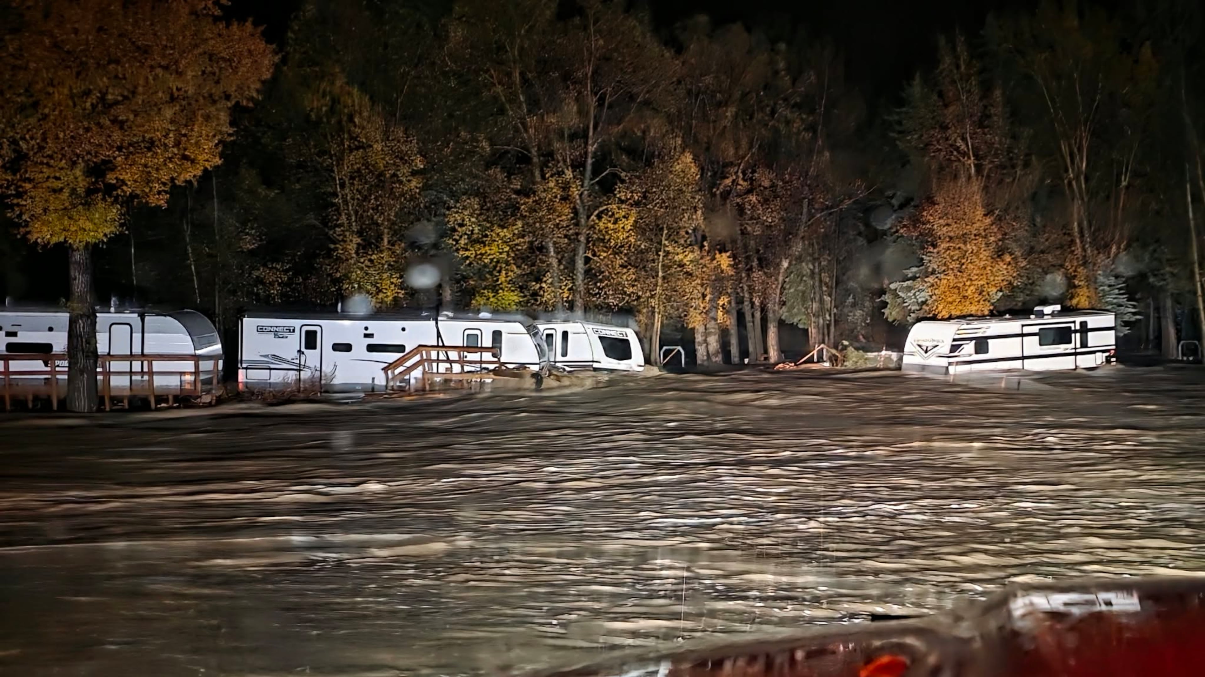 Floodwaters surround trailers at the Fun Valley Family Resort campground and RV part in South Fork, Colo., early Friday, Oct. 23, 2026. (South Fork Fire Rescue via AP)