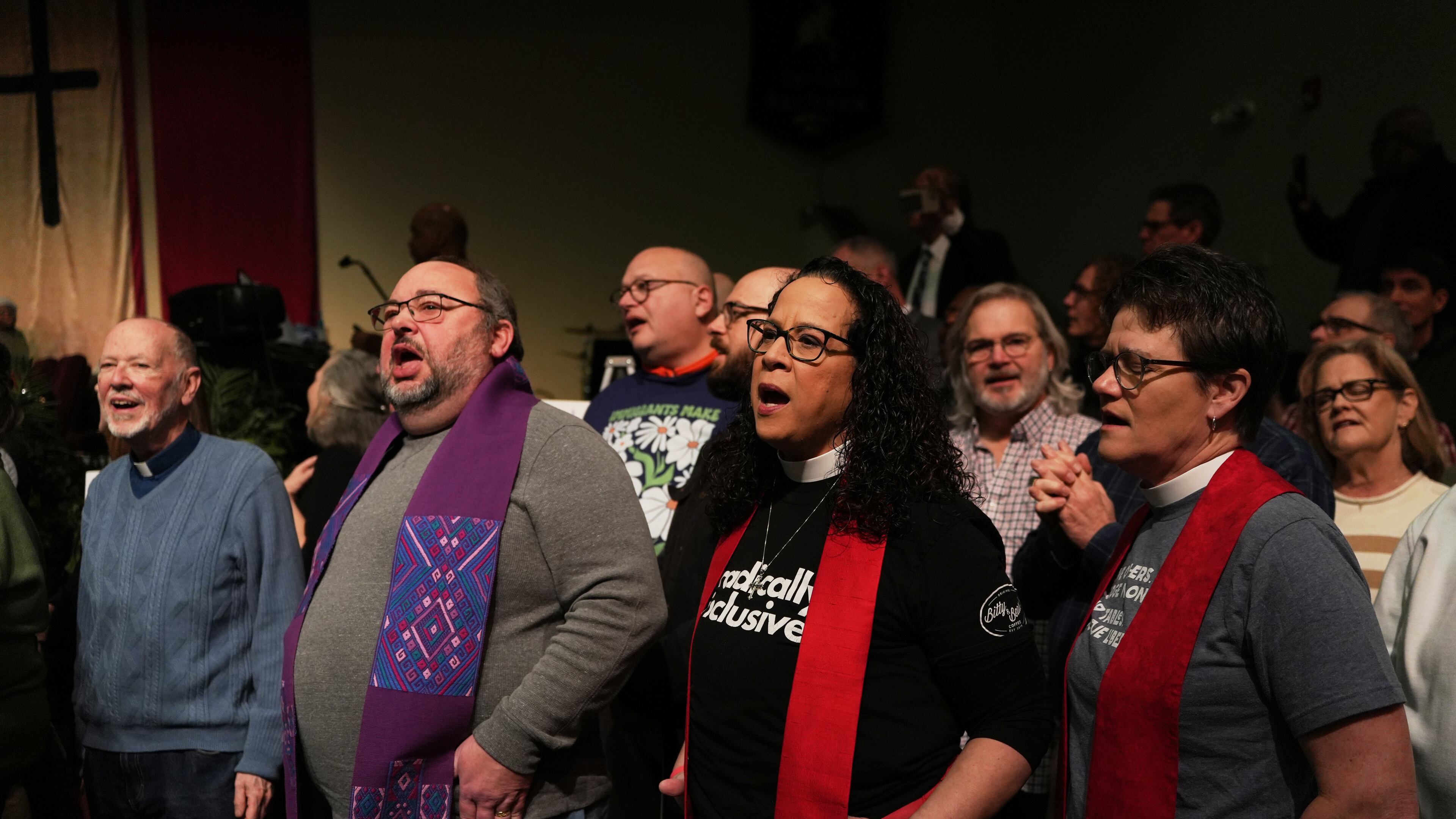 Faith leaders sing together as a sign of support for Haitian migrants fearing the end of their Temporary Protected Status in the U.S., at an event held at St. John Missionary Baptist Church in Springfield, Ohio on Monday, Feb. 2, 2026. (AP Photo/Luis Andres Henao)
